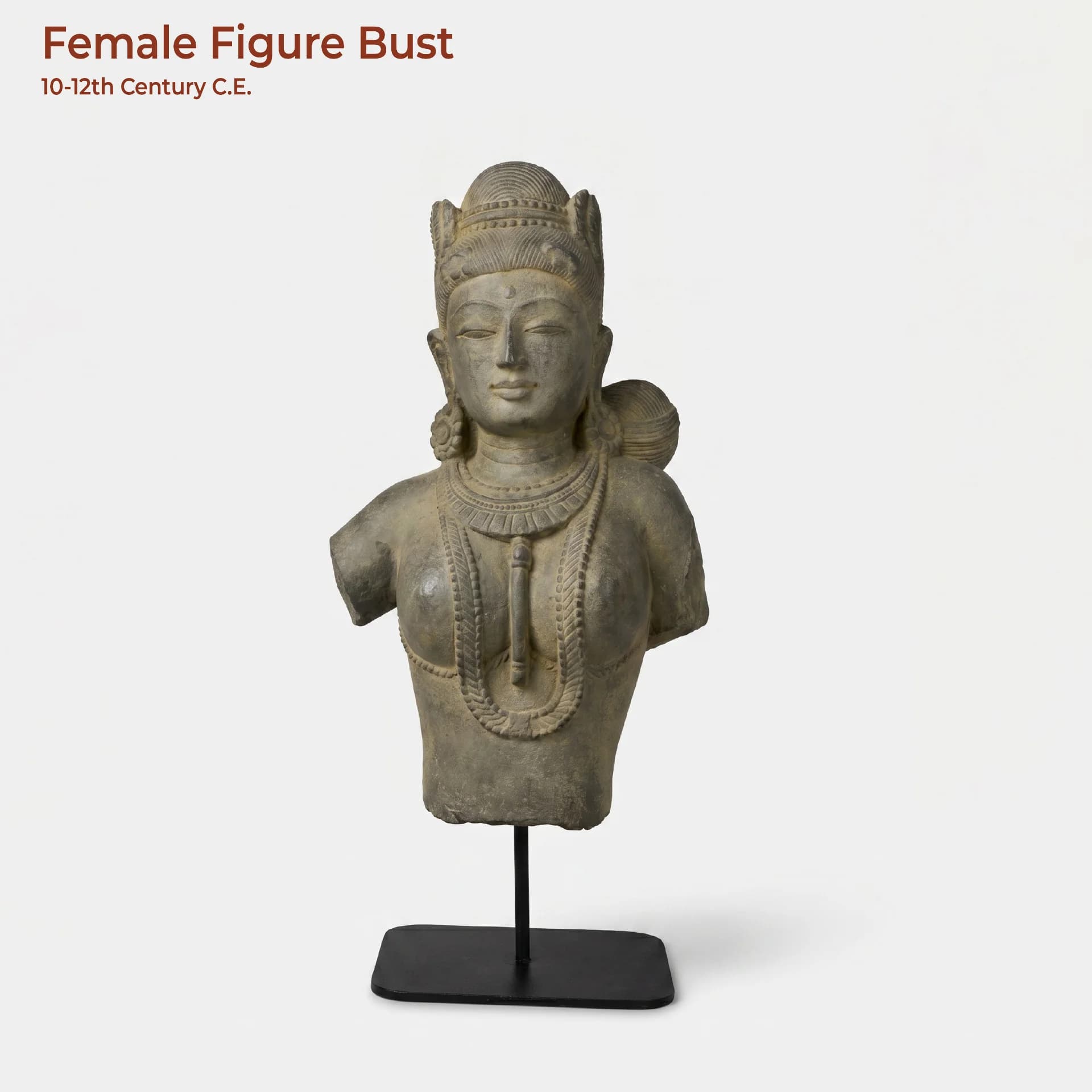 A front-facing view of the Female Figure Bust Sculpture, a stone composite replica featuring ornate traditional Indian jewelry.