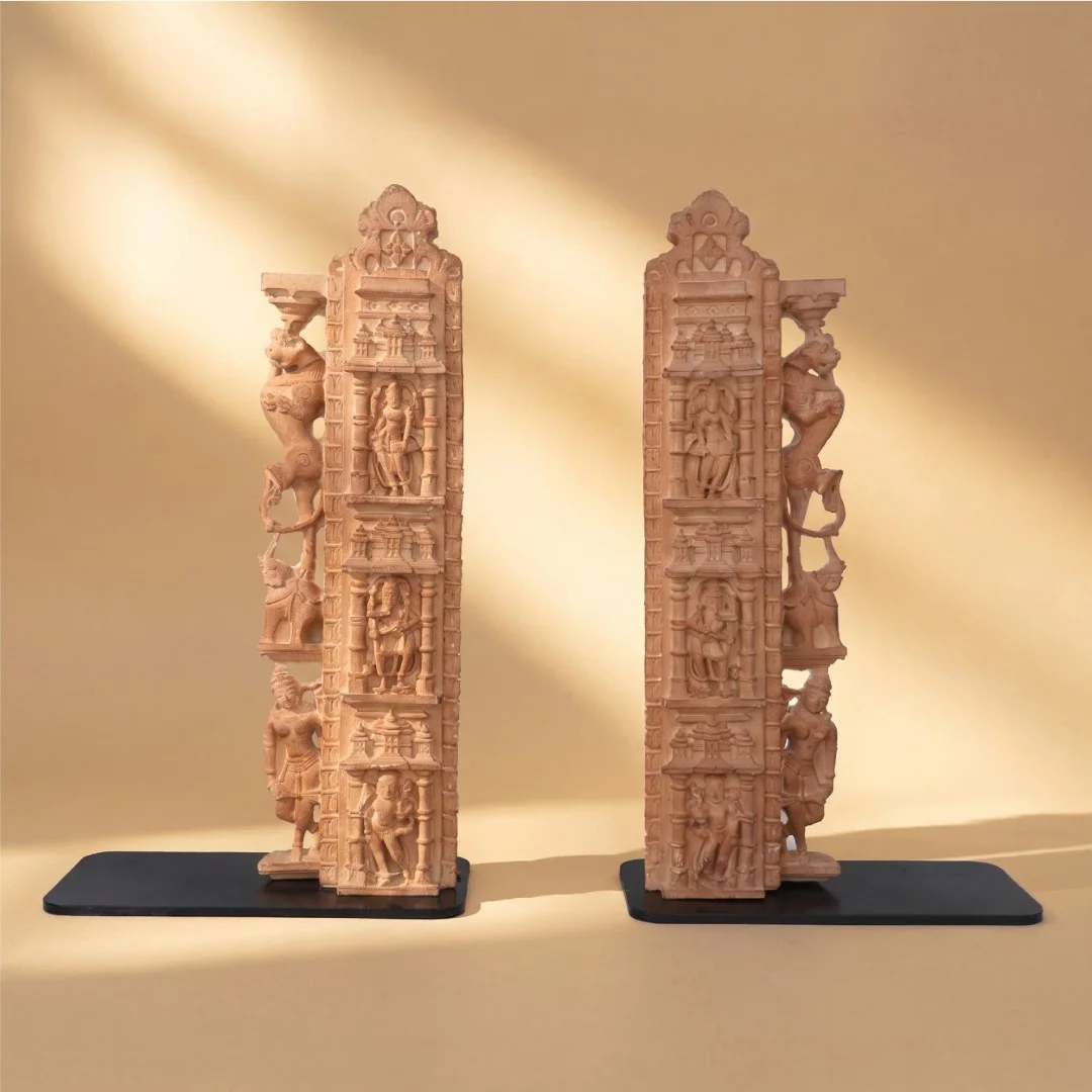 A pair of Dwara Shakha Sculpture bookends crafted from stone composite, featuring intricate 11th-century temple architectural carvings.