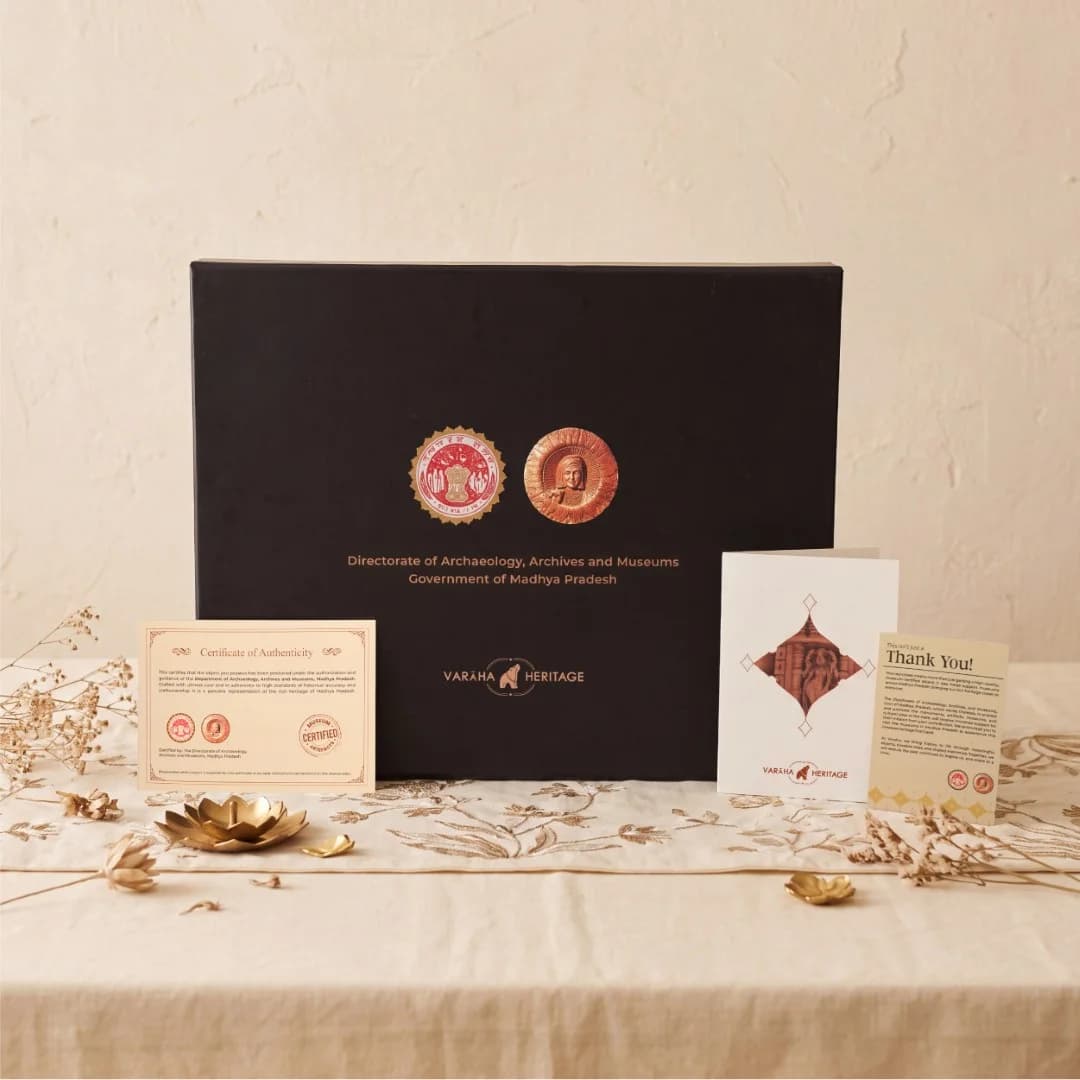 The Dwara Shakha Sculpture packaging box displayed with its certificate of authenticity and a thank you note.