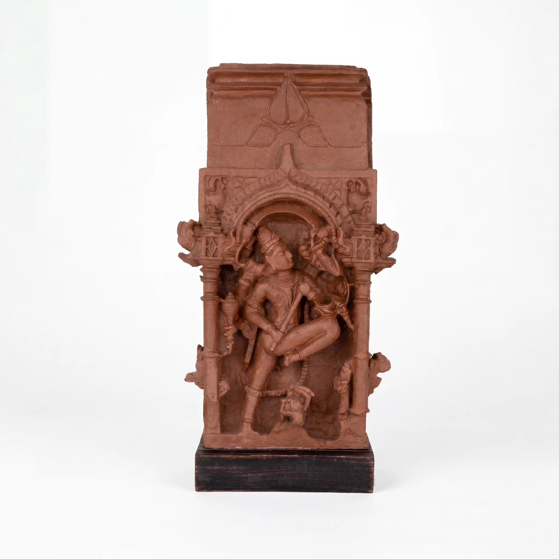A full-front view of the Gajasura Vadha Sculpture, a terracotta-style museum replica featuring intricate temple relief carvings of Shiva.