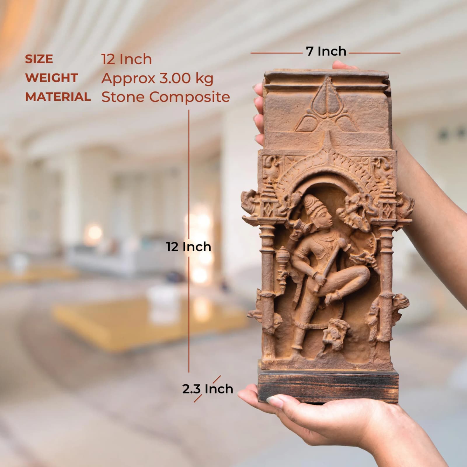A person holds the Gajasura Vadha Sculpture, a stone composite replica, showing its physical size and dimensions against a blurred background.