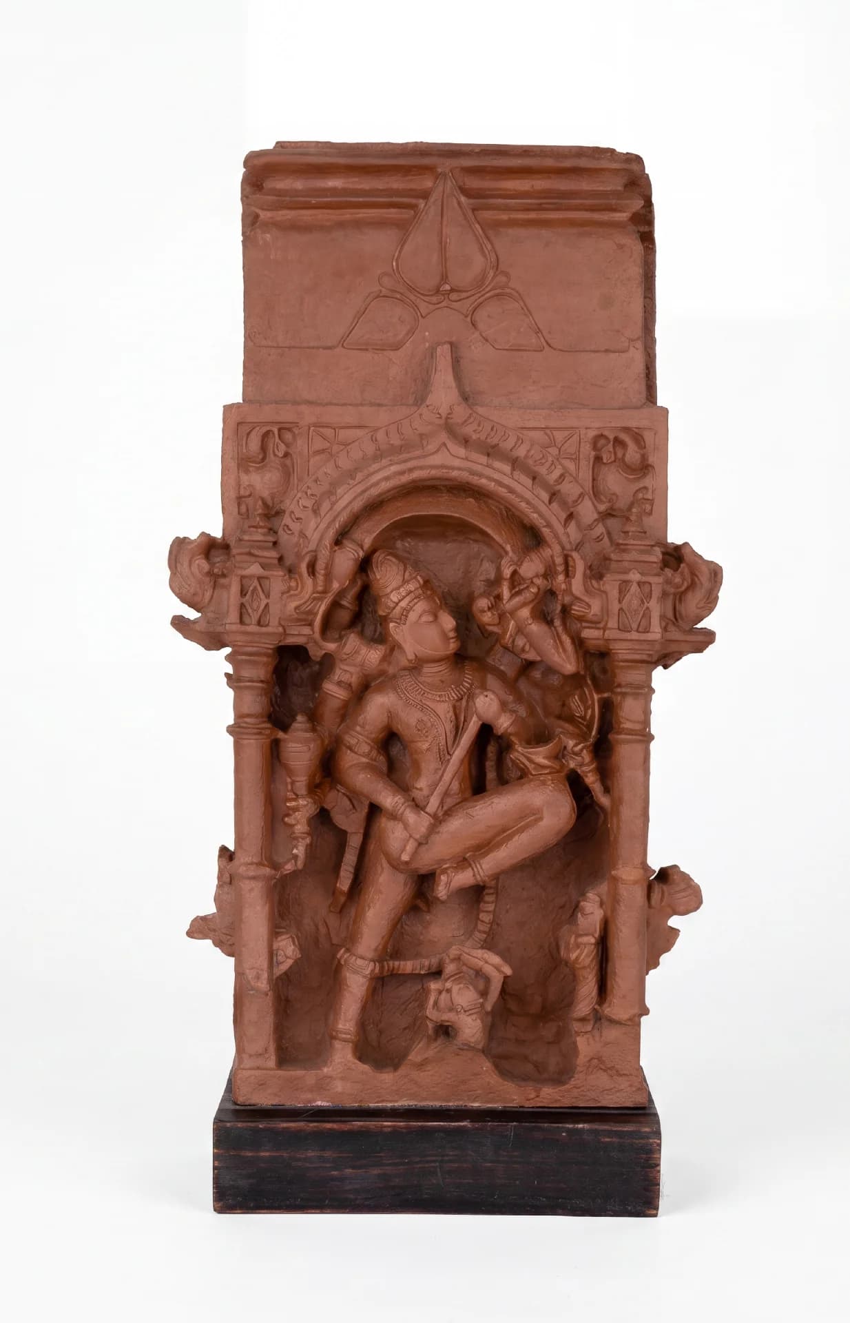 A full-front view of the Gajasura Vadha Sculpture, a terracotta-style museum replica showing Shiva in a dynamic temple relief.