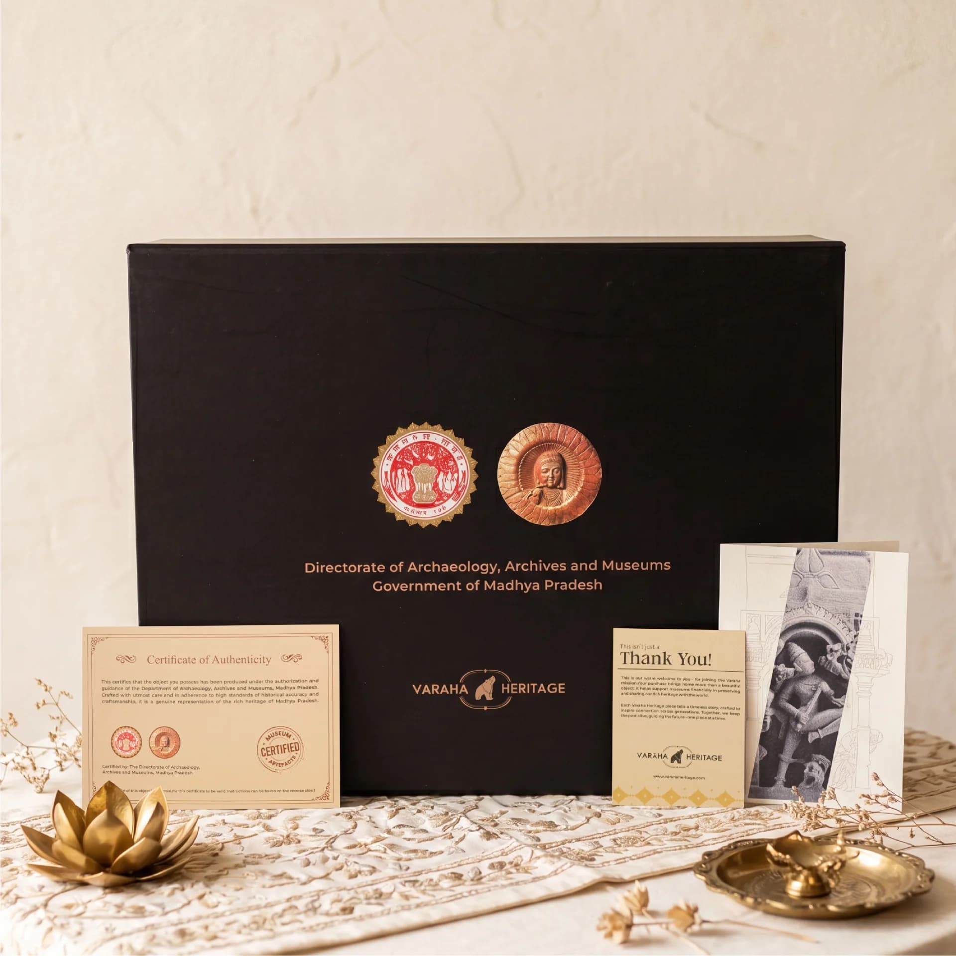 A black presentation box for the Gajasura Vadha Sculpture, accompanied by a certificate of authenticity and a thank you card.