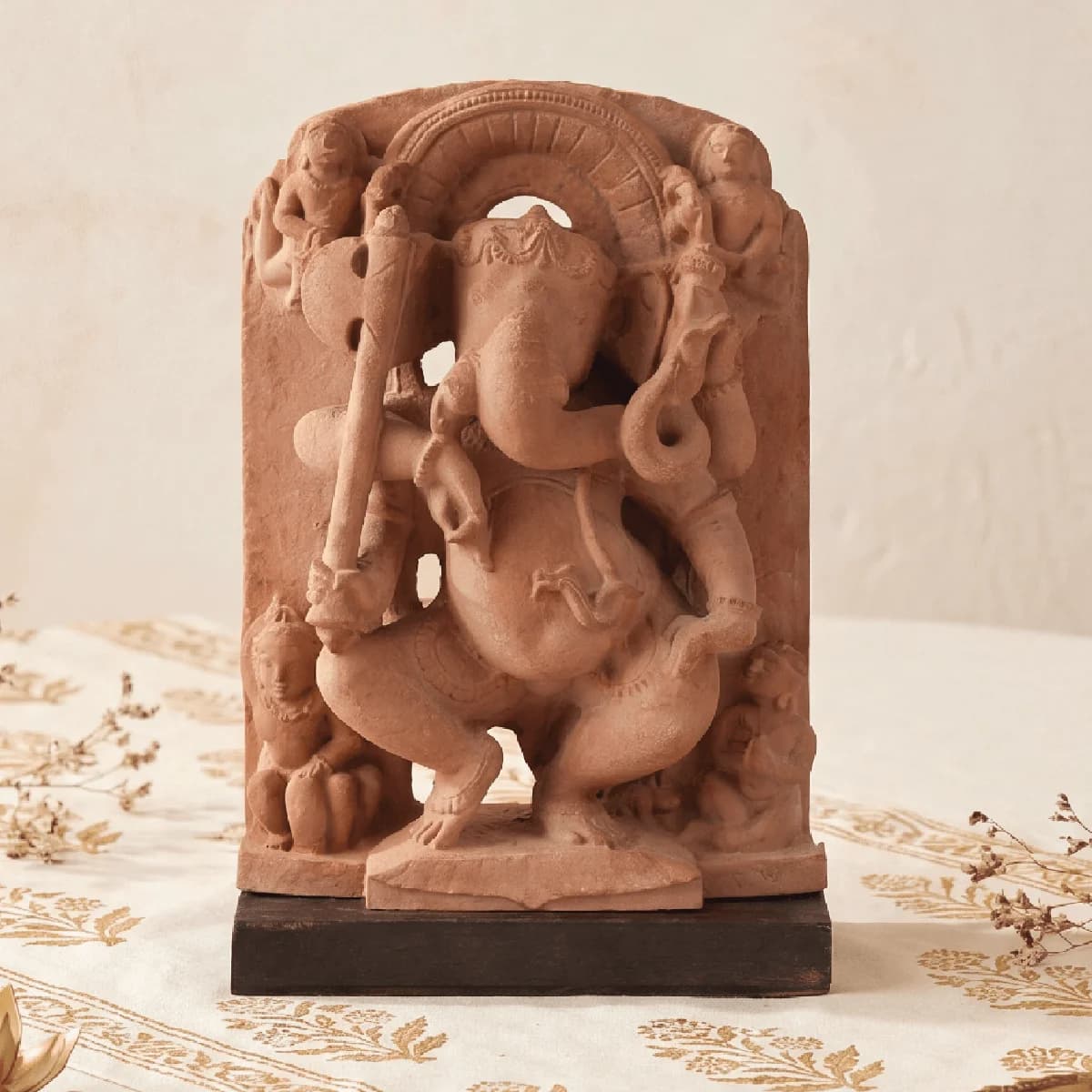 A front view of the Ganesha Sculpture, a hand-finished stone composite replica depicting the deity in a dancing pose.