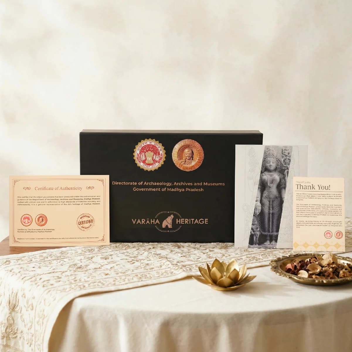 The Gauri Parvati Sculpture packaging set includes a black presentation box, a certificate of authenticity, and a thank you card.