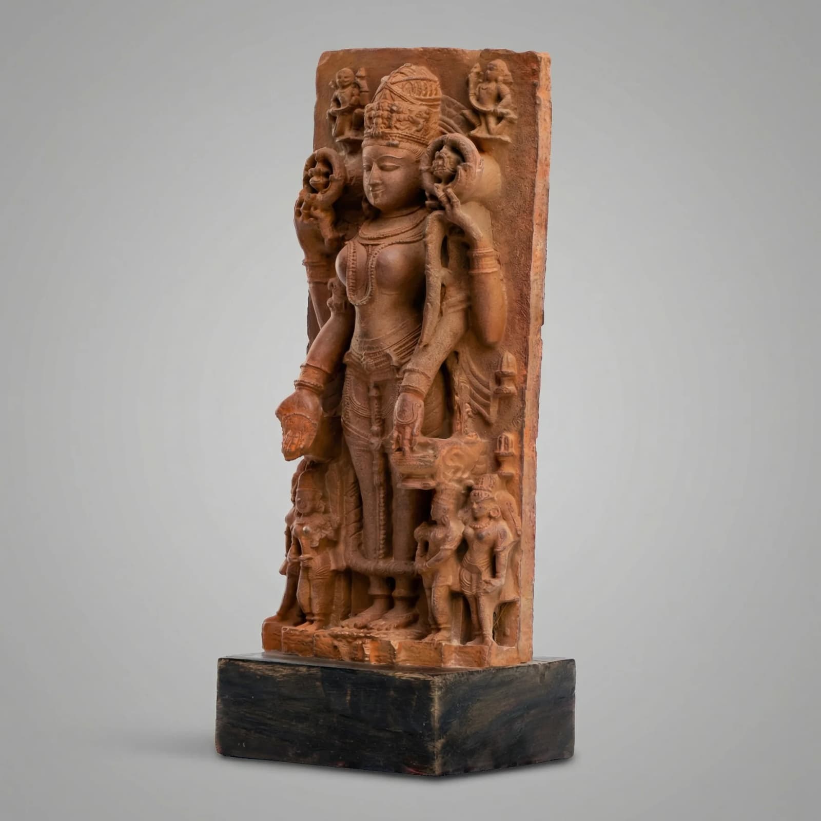 A three-quarter view of the Gauri Parvati Sculpture, a detailed stone composite replica featuring intricate Pratihara style carvings.