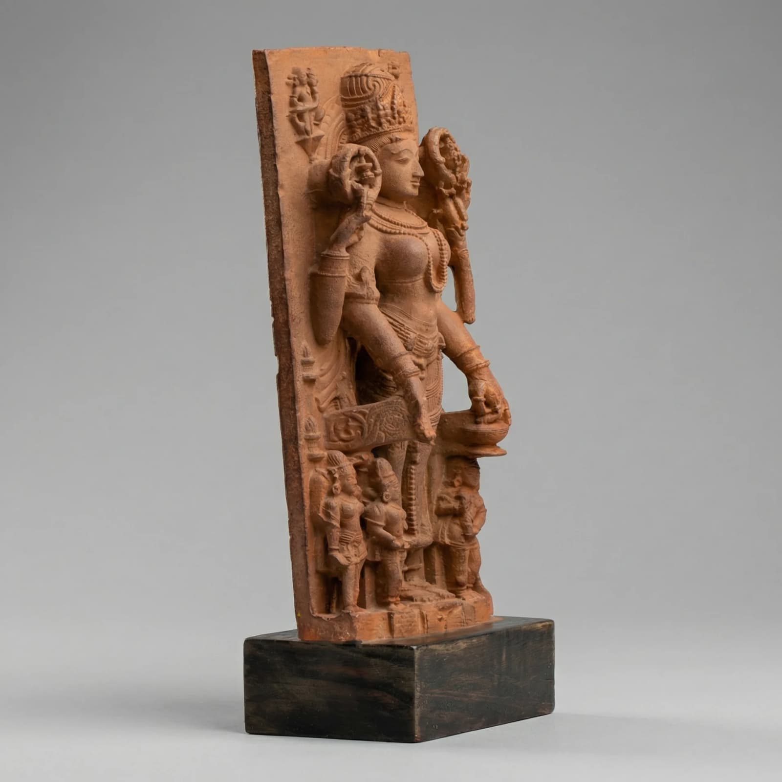 A three-quarter view of the Gauri Parvati Sculpture, a stone composite replica featuring intricate temple art carvings.