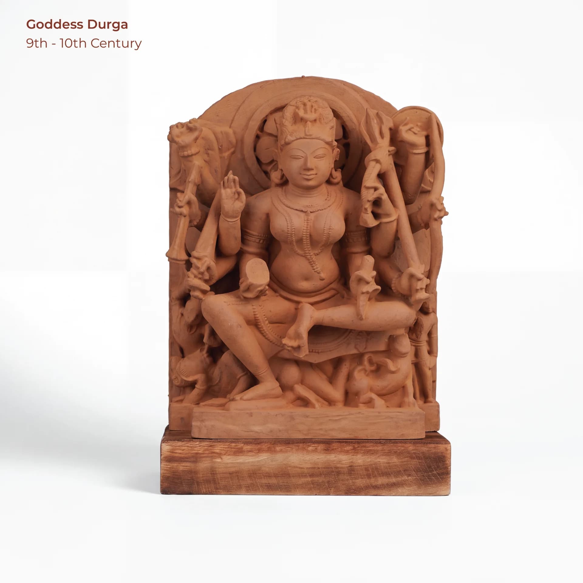 A front-facing view of the Goddess Durga Sculpture, a hand-finished stone replica featuring intricate medieval-style carvings and details.