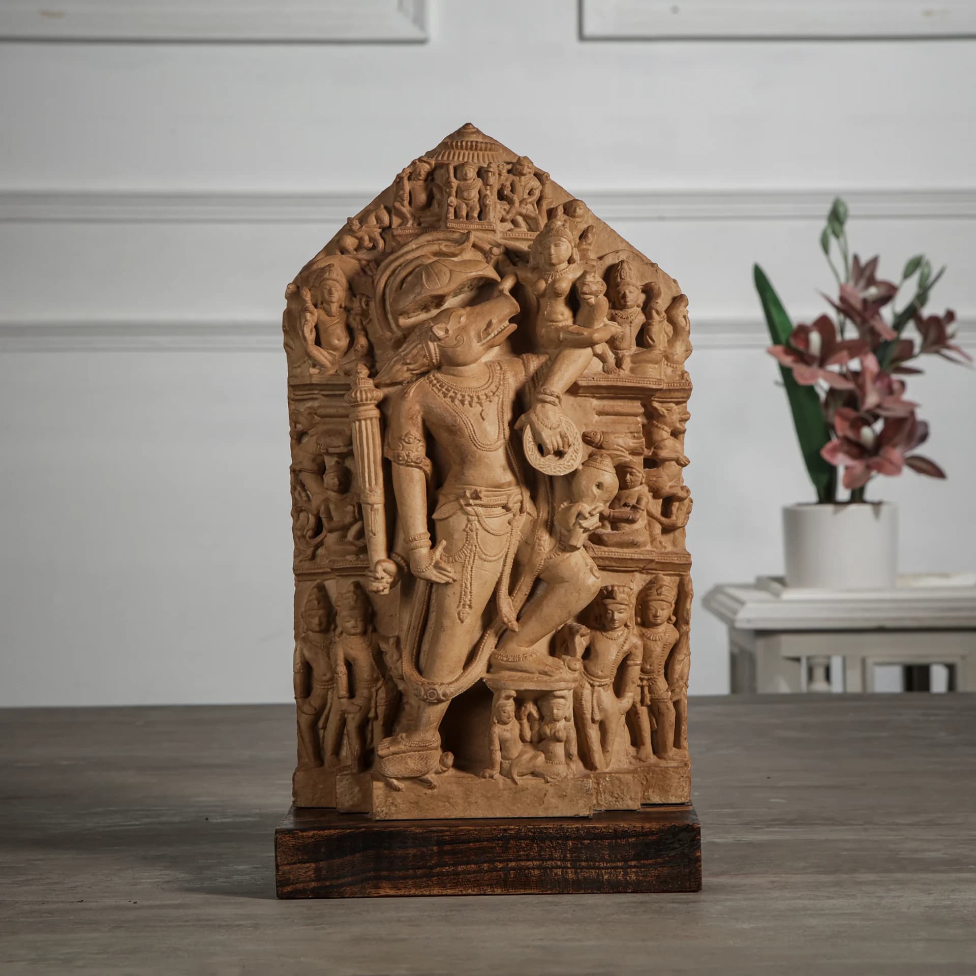 A detailed stone composite Nar Varaha Sculpture showing the man-boar deity rescuing Bhudevi in a traditional temple art style.