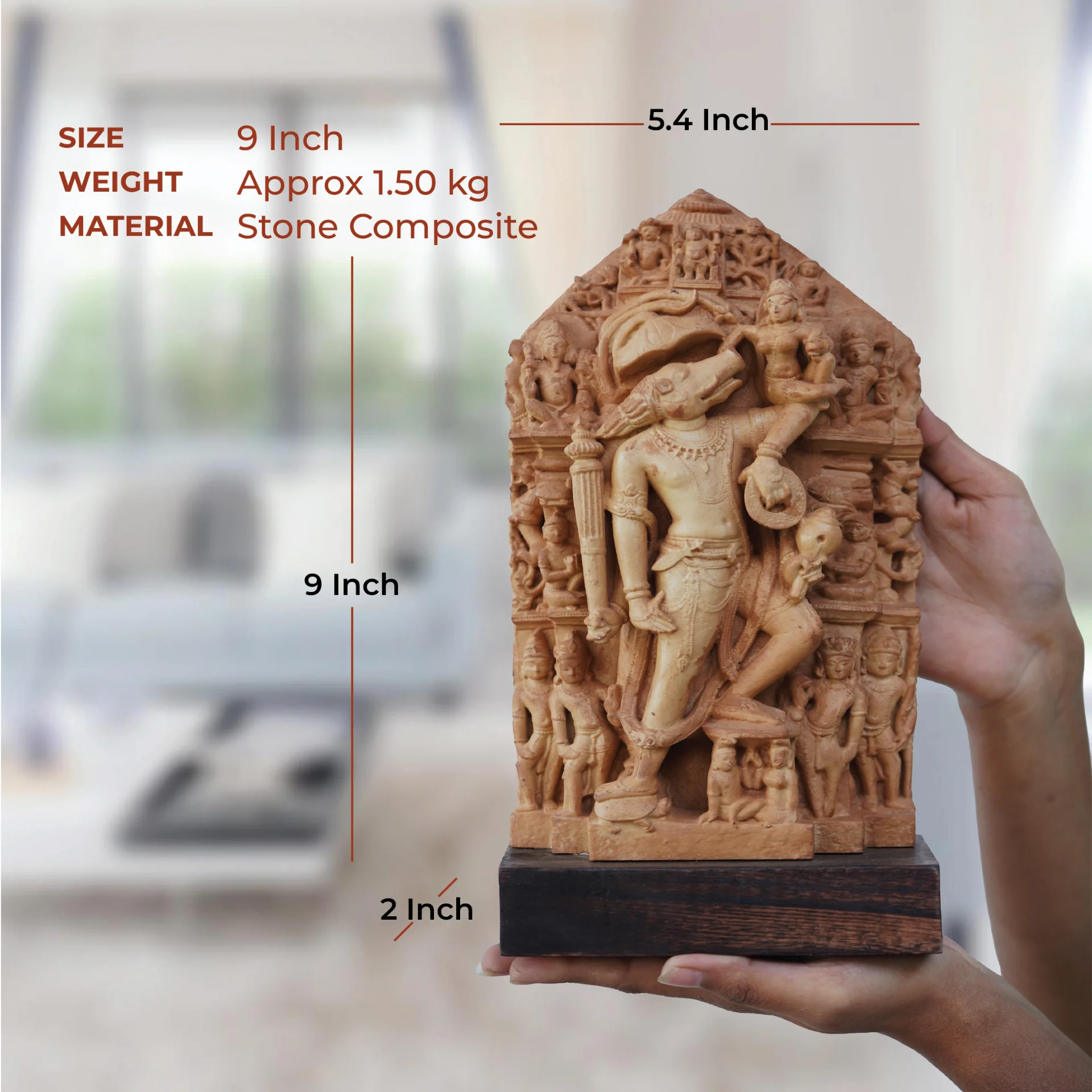 A person holds the Nar Varaha Sculpture, a stone composite replica, showing its physical scale and dimensions against a blurred background.