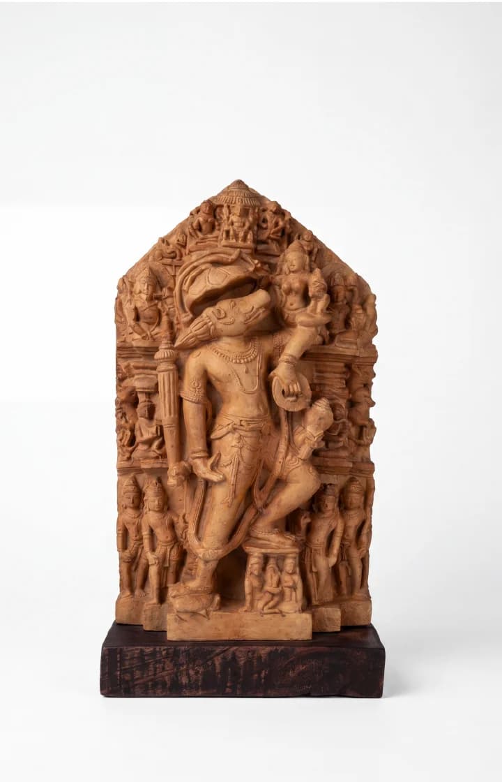 A full front view of the Nar Varaha Sculpture, a hand-finished stone composite replica featuring intricate temple art carvings.