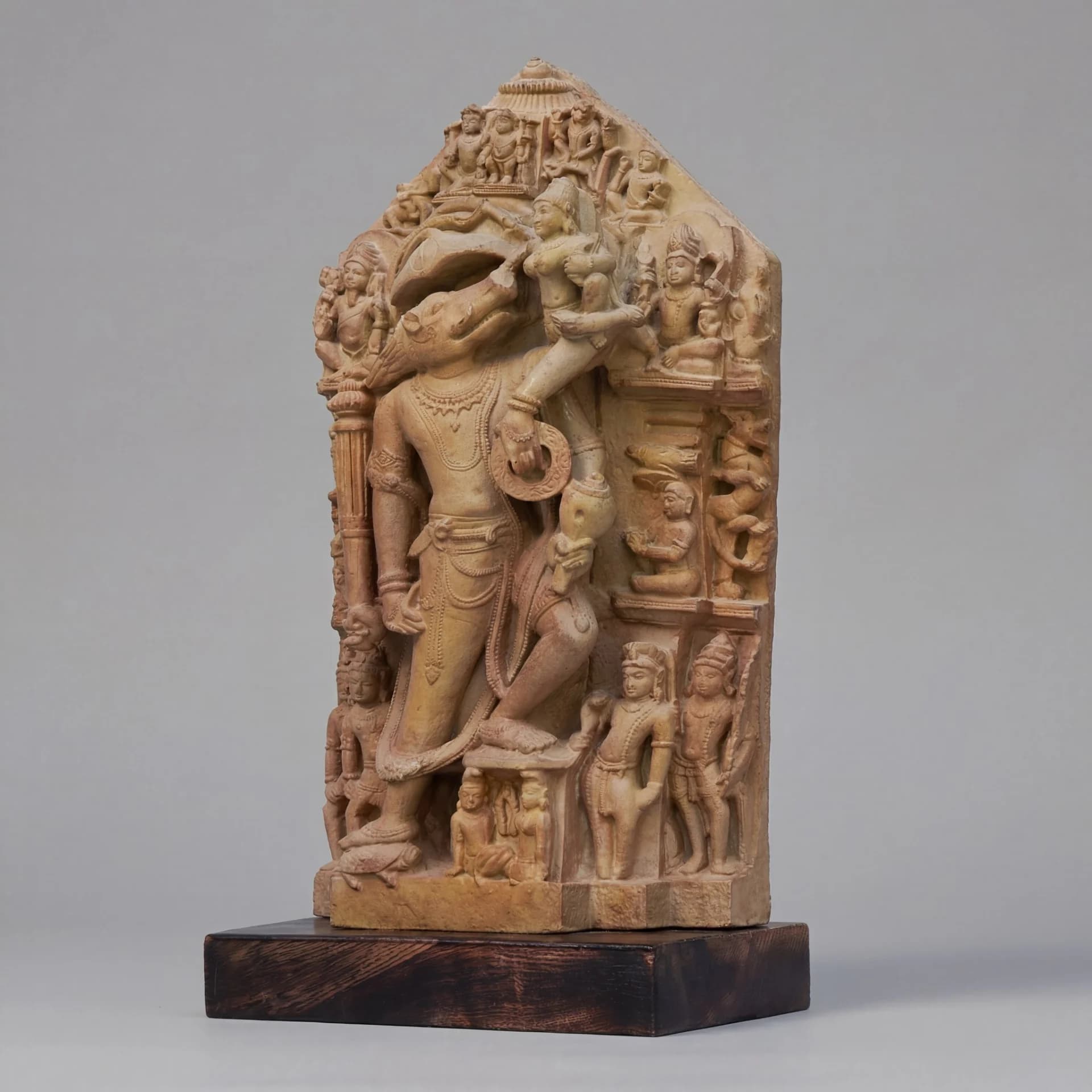 A three-quarter view of the Nar Varaha Sculpture, a hand-crafted stone composite replica featuring intricate temple art carvings.