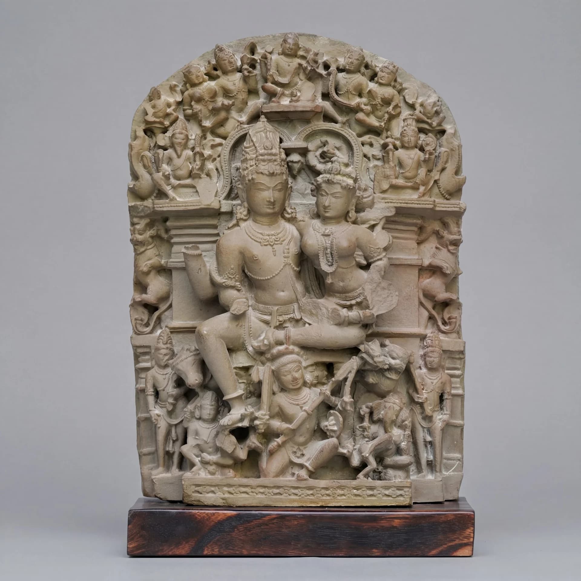 A front-facing view of the stone composite Ravananugraha Sculpture showing intricate 11th-century style carvings of Shiva and Ravana.