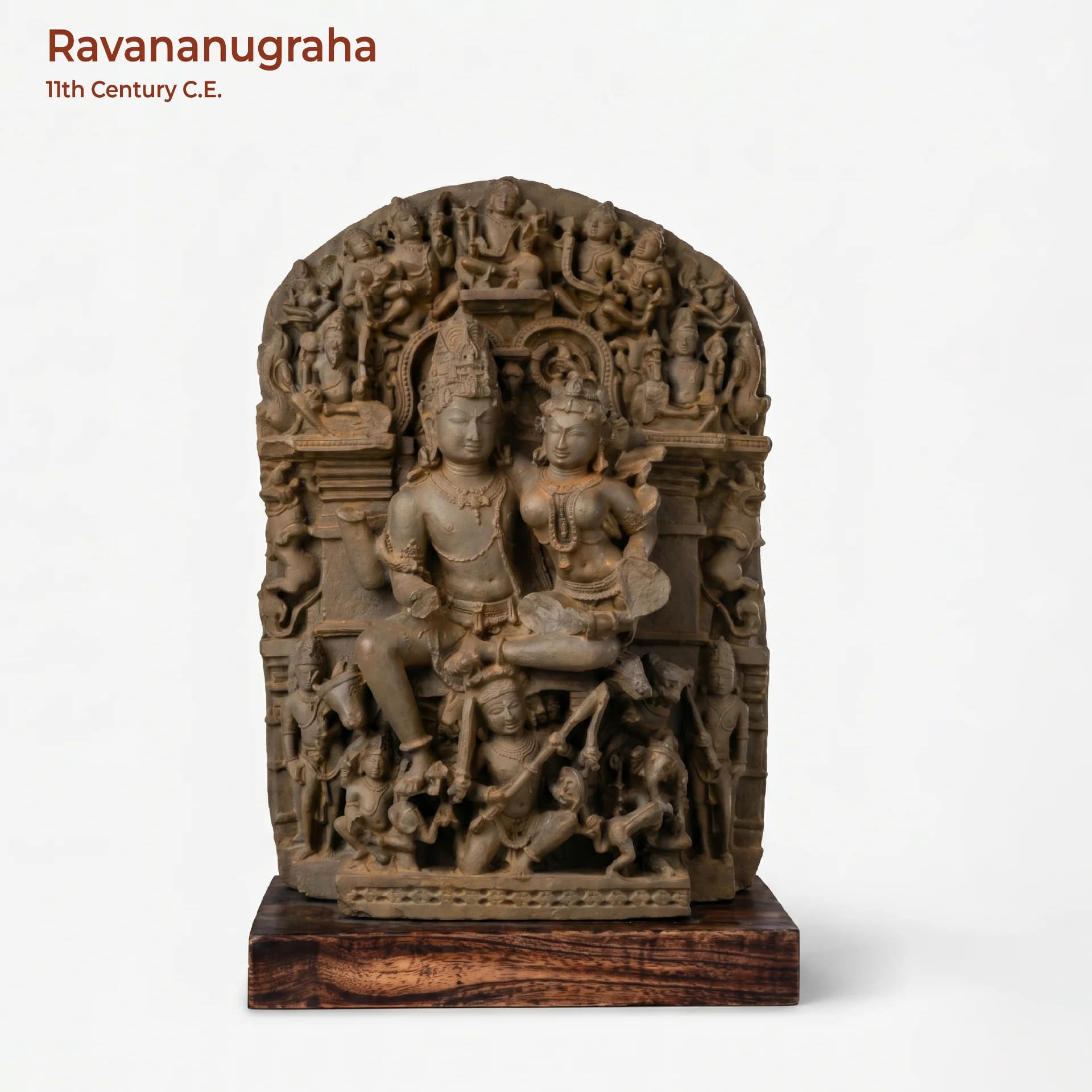 A full-front view of the Ravananugraha Sculpture, a stone composite museum replica showing Shiva and Parvati seated together.