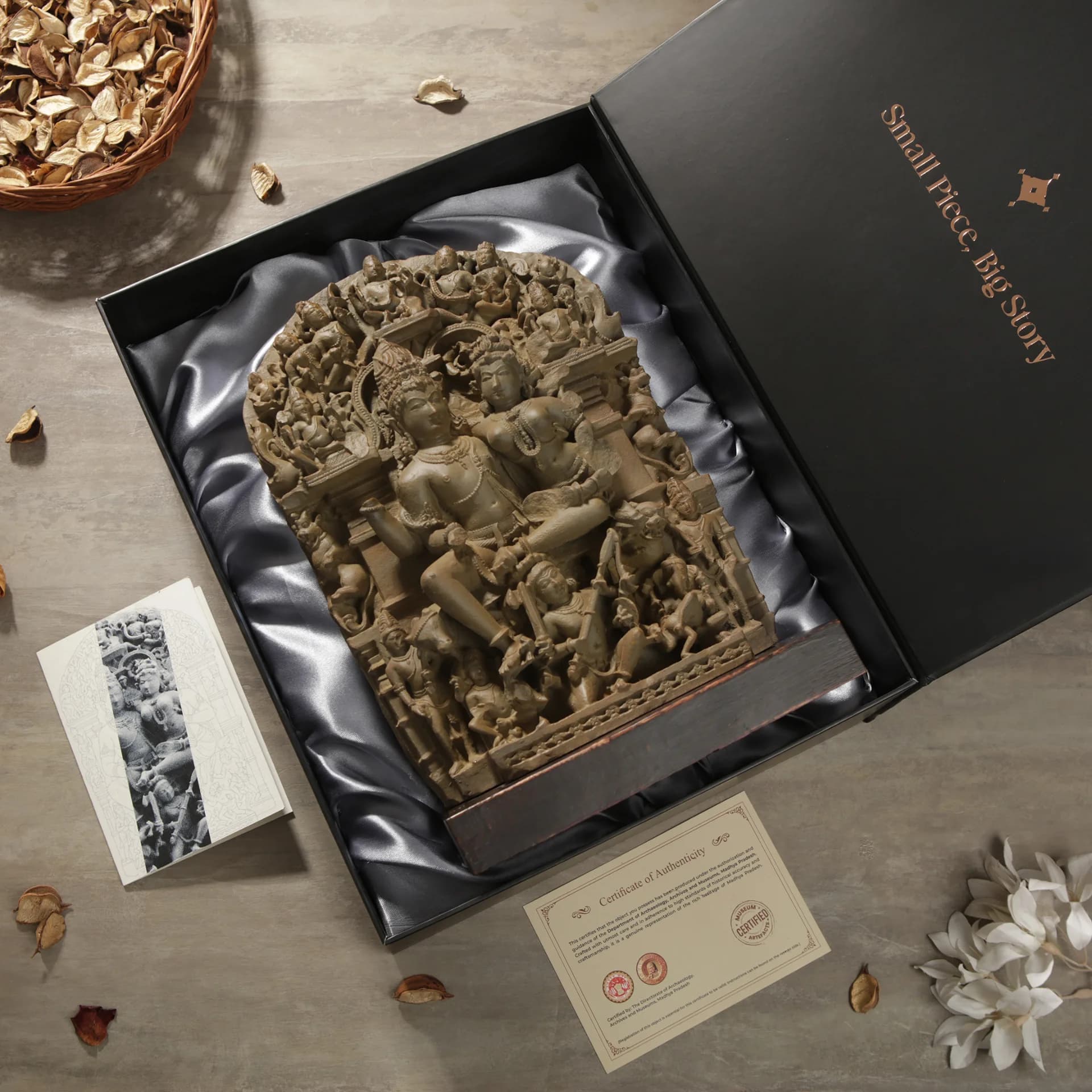 A stone composite Ravananugraha Sculpture displayed inside a premium black gift box with a certificate of authenticity.