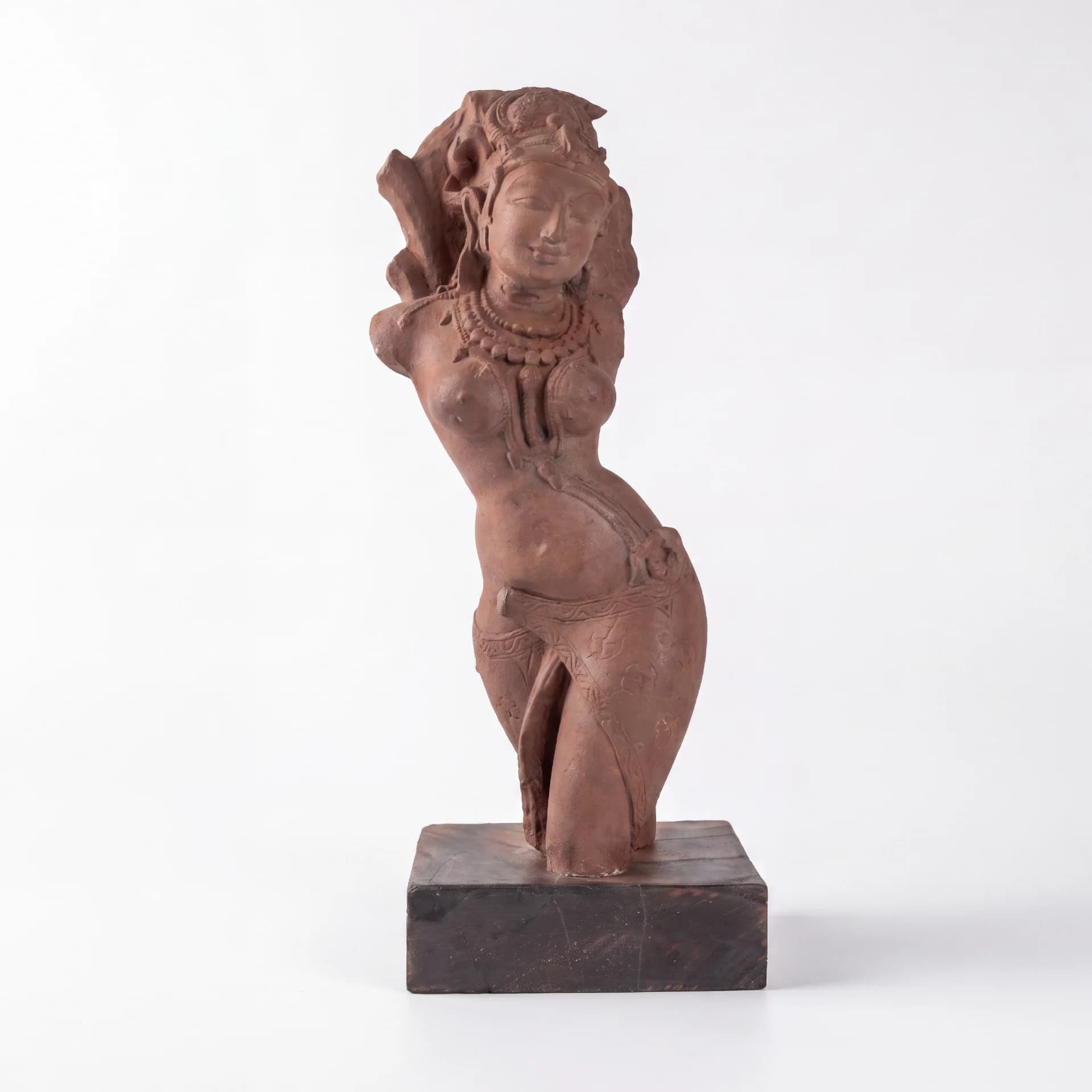 A full-front view of the Salabhanjika Sculpture, a stone composite museum replica featuring an elegant tribhanga pose on a wooden base.