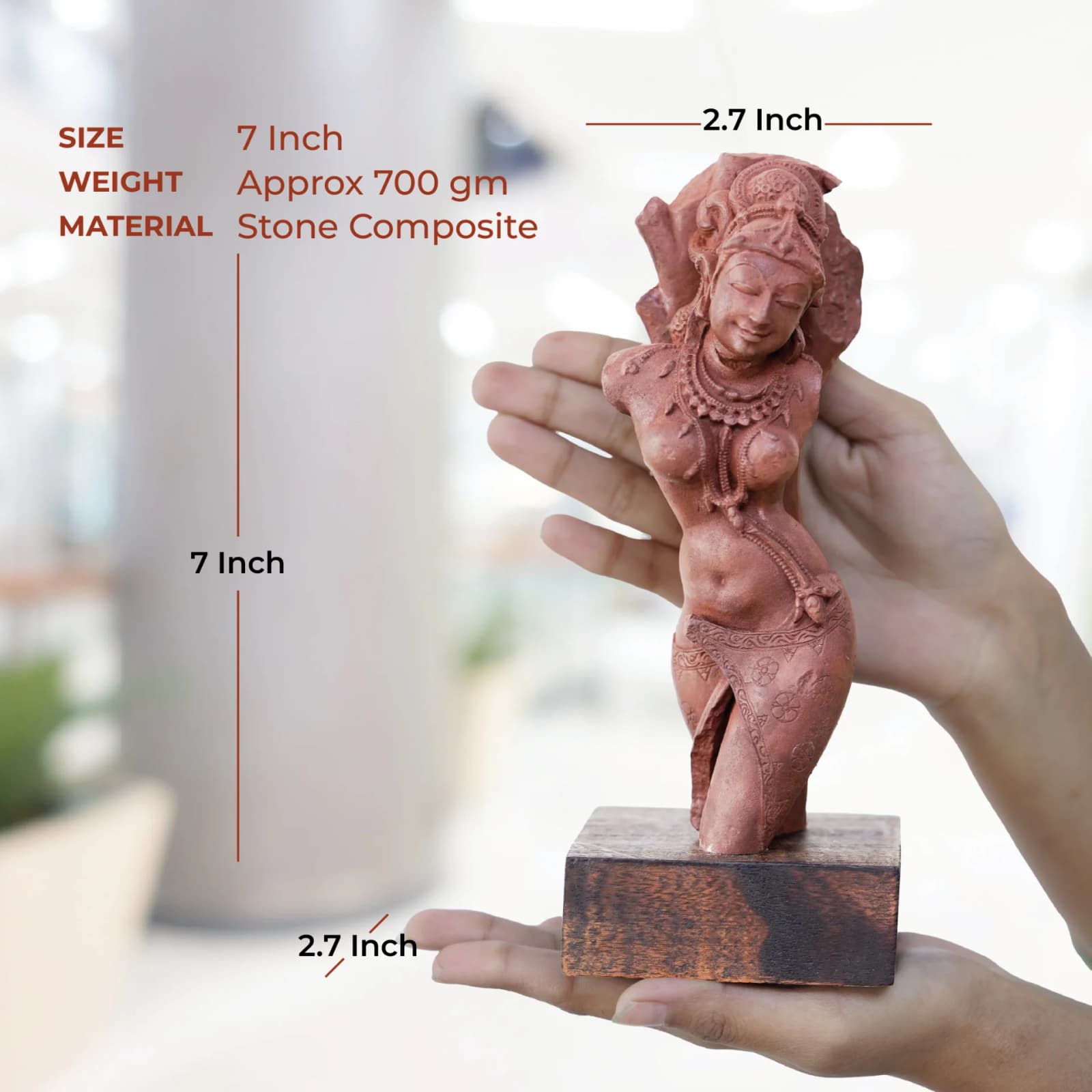 A person holds the Salabhanjika Sculpture, a stone composite replica, showing its scale with overlaid dimensions in inches.