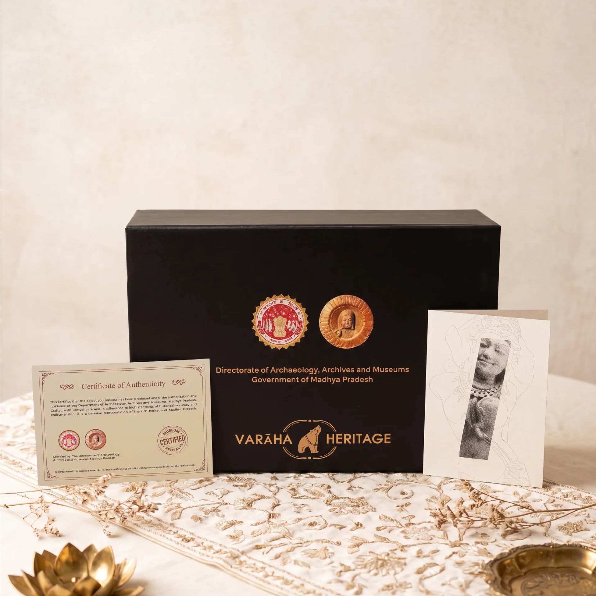 A black presentation box for the Salabhanjika Sculpture, featuring official government branding, a certificate of authenticity, and an illustrated information card.