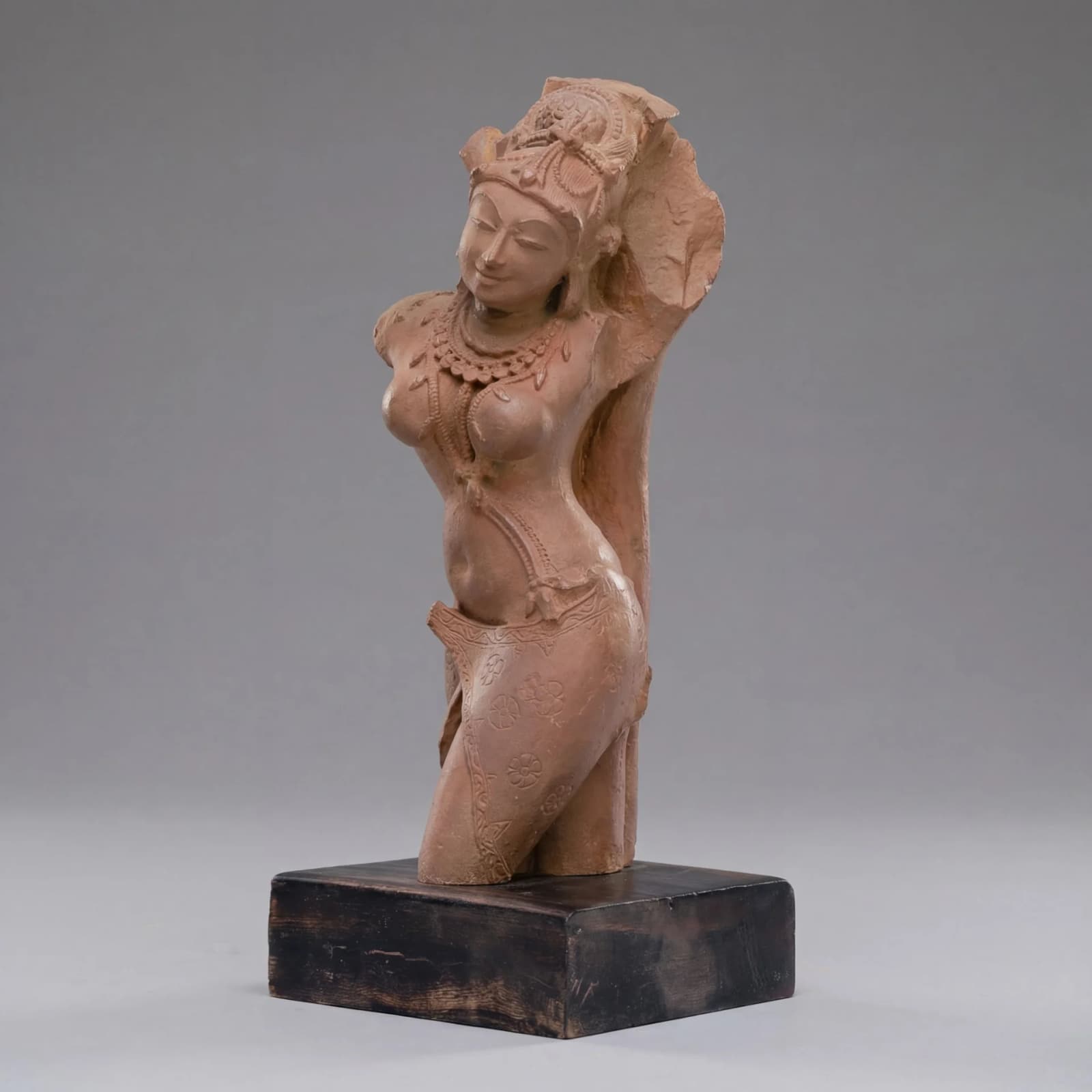 A three-quarter view of the Salabhanjika Sculpture, a stone composite replica showing the figure in a graceful tribhanga pose.