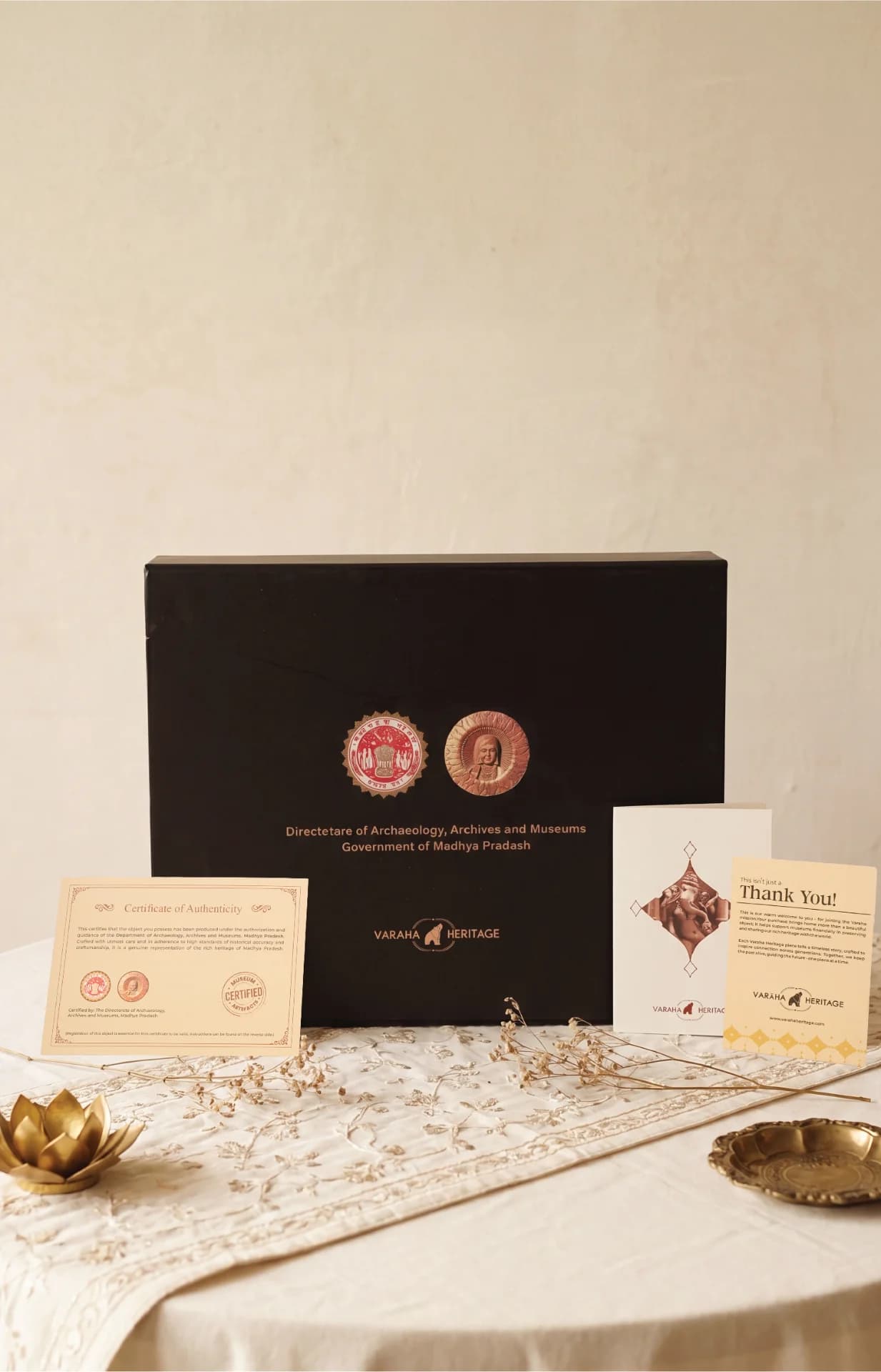 A black presentation box for the Vinayaki Sculpture museum replica, accompanied by an official certificate of authenticity and a thank you card.