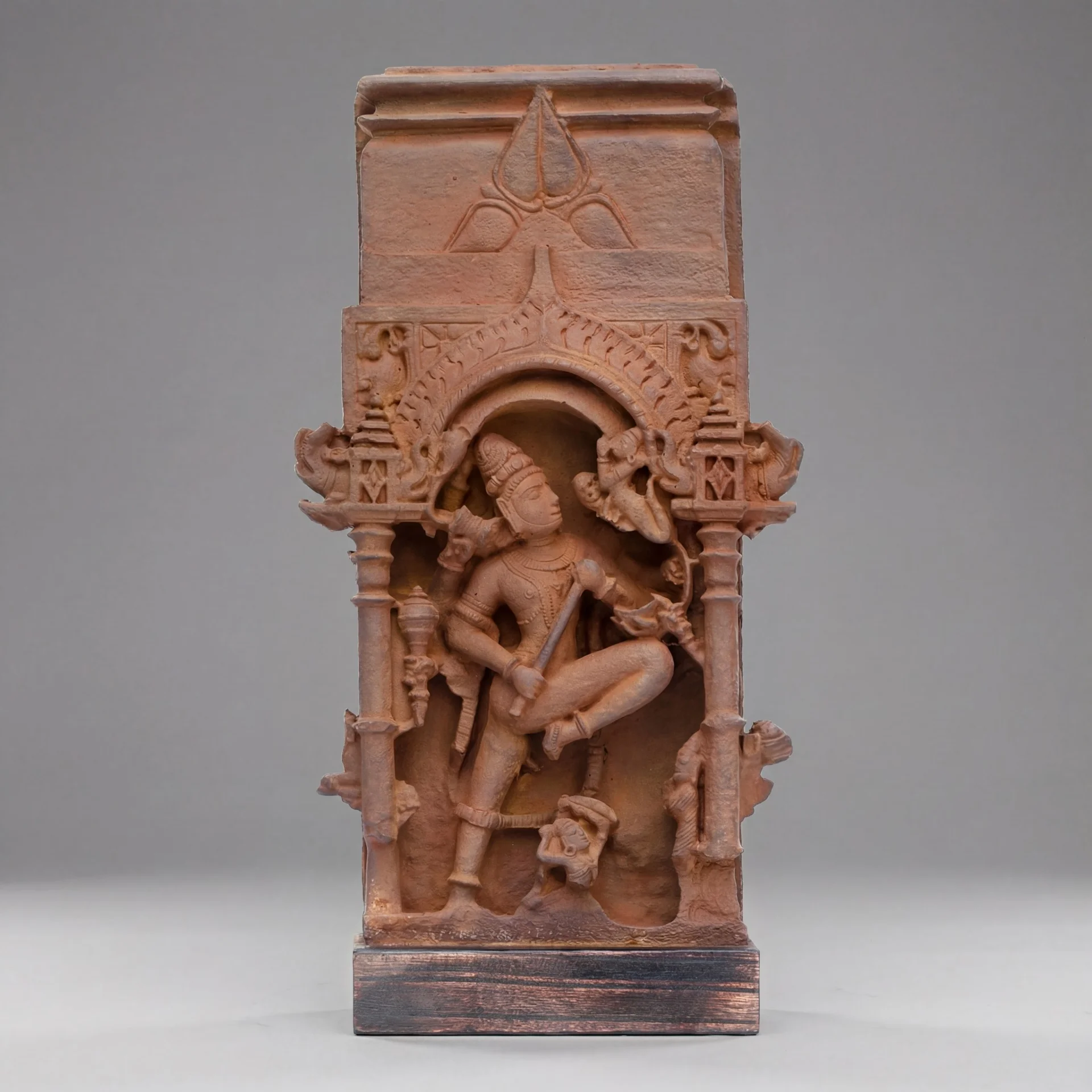 A full front view of the Gajasura Vadha Sculpture, a stone composite replica featuring intricate temple relief carvings of Shiva.