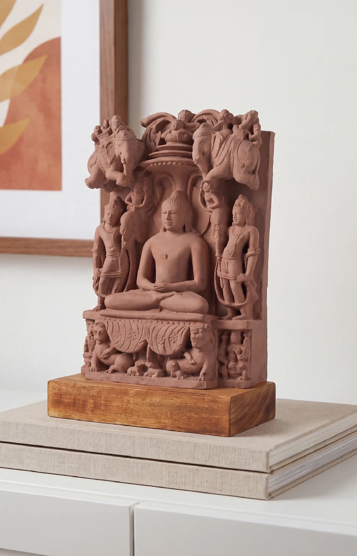 The Adinath Sculpture museum replica, hand-finished in stone composite, displays the Tirthankara seated in meditation on a wooden base.