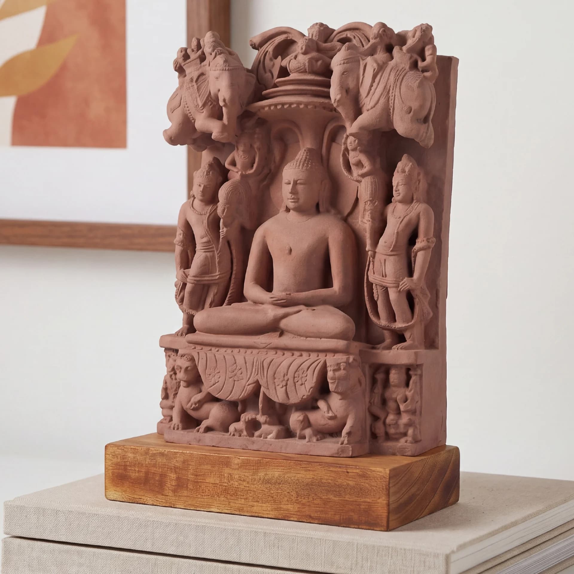 A stone composite Adinath Sculpture displaying the Tirthankara seated in meditation, flanked by intricate carvings on a wooden base.