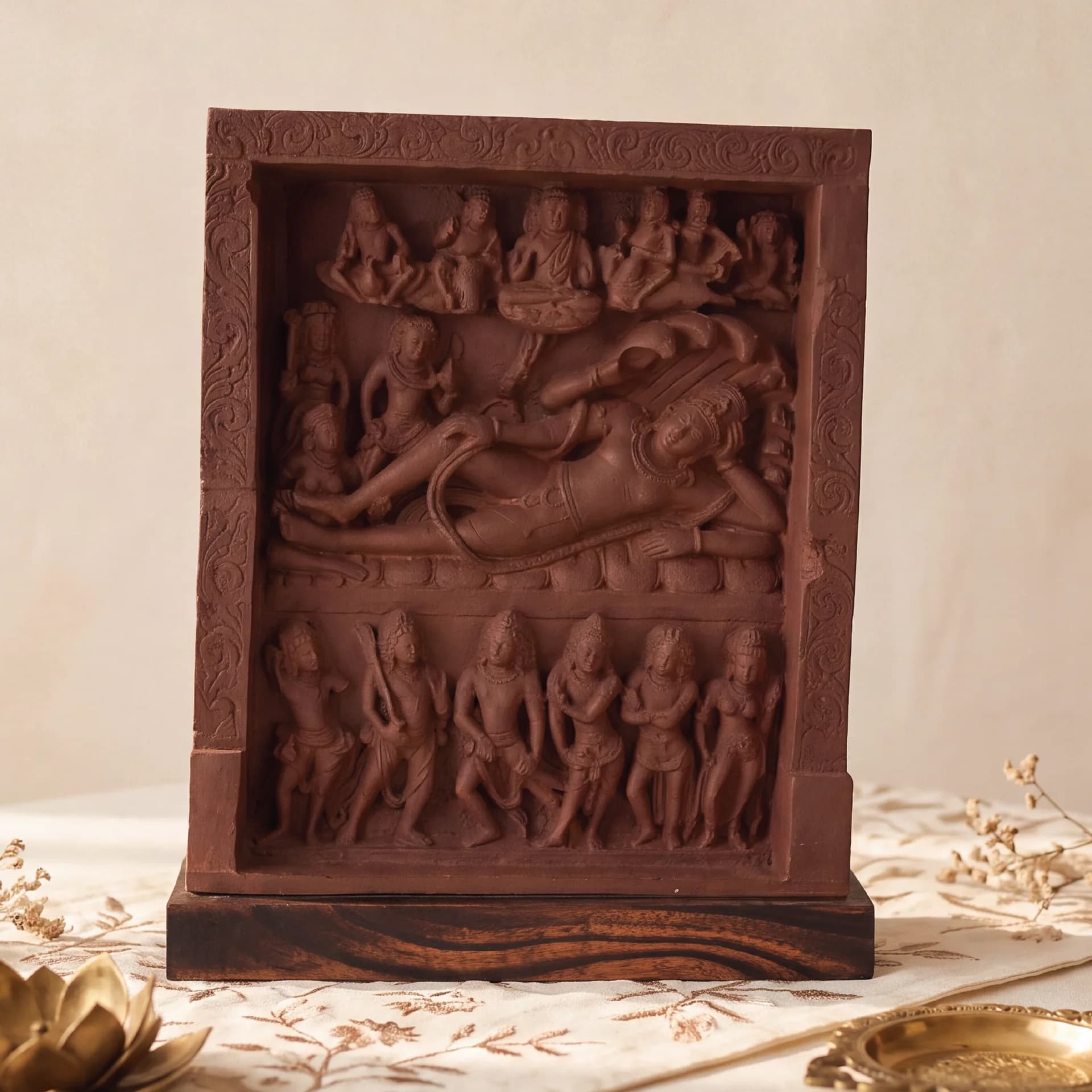 A front-facing view of the Anantasayana Vishnu Sculpture, a terracotta-style museum replica featuring intricate Gupta-period relief carvings of deities.