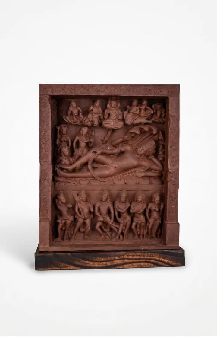 A front-facing view of the Anantasayana Vishnu Sculpture, a detailed terracotta-style museum replica featuring intricate relief carvings of deities.