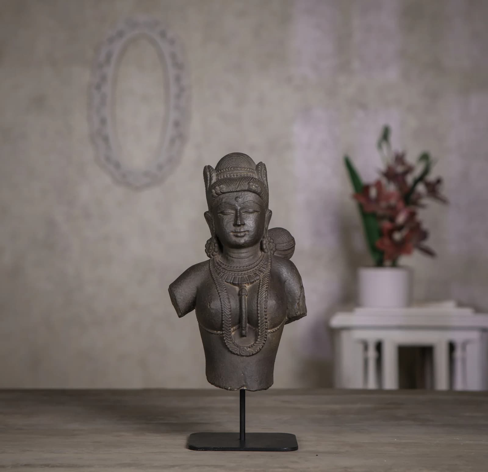 A front-view studio shot of the Female Figure Bust Sculpture, showcasing its detailed stone composite craftsmanship and Chola-inspired features.