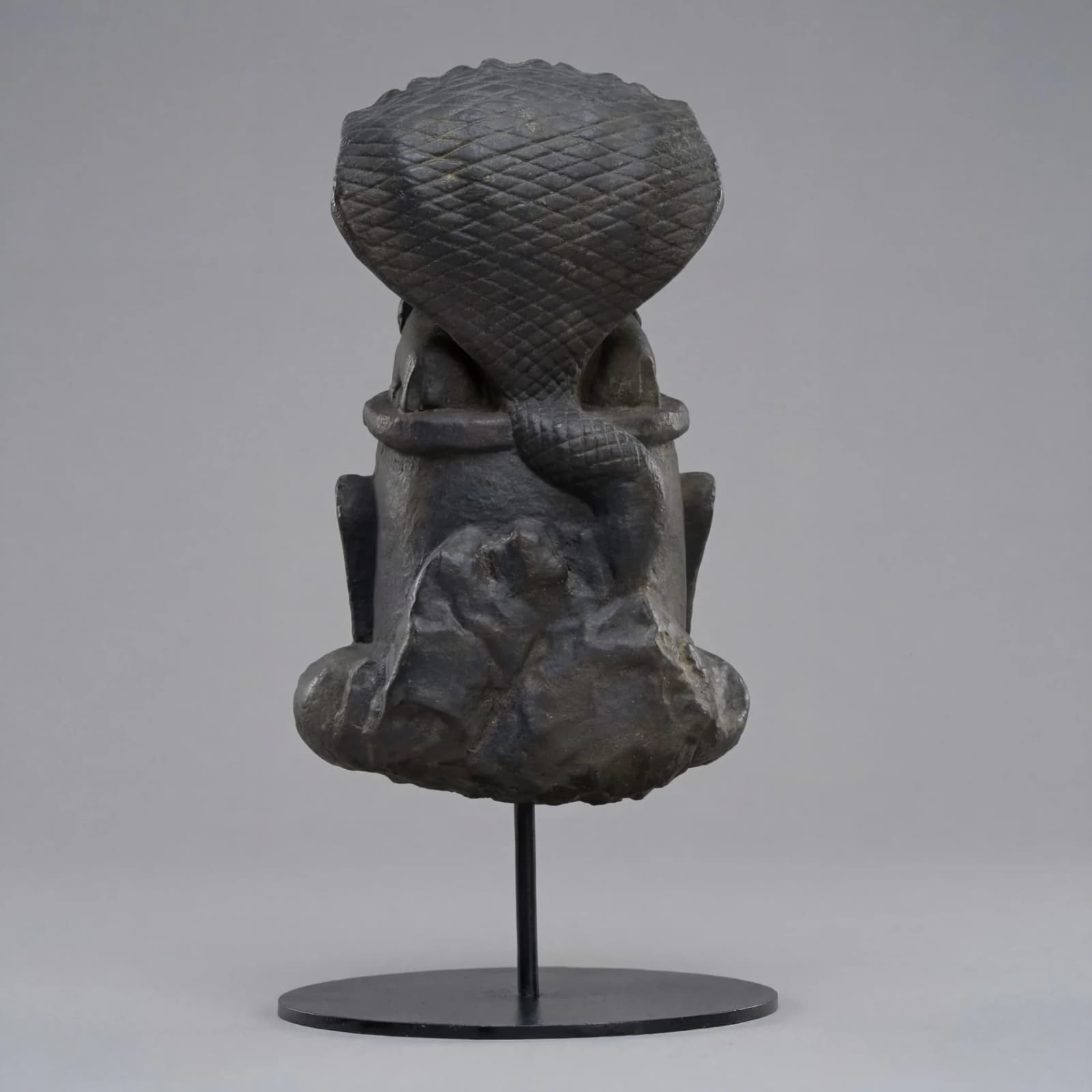 The rear view of the Shiva Lingam with Nandi & Serpent replica, showcasing the intricate stone composite texture and cobra hood.