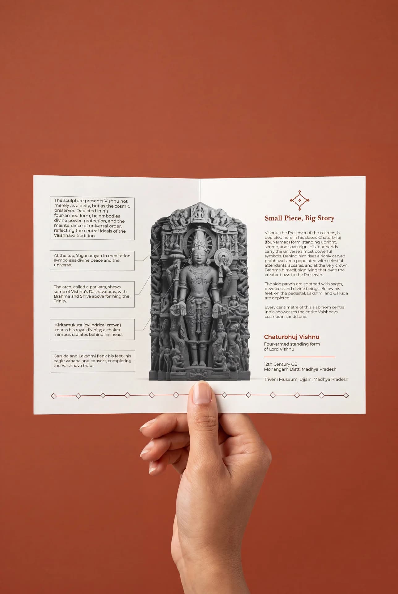 A hand holds an informational brochure featuring the Chaturbhuj Vishnu Sculpture, a detailed stone composite museum replica with descriptive annotations.