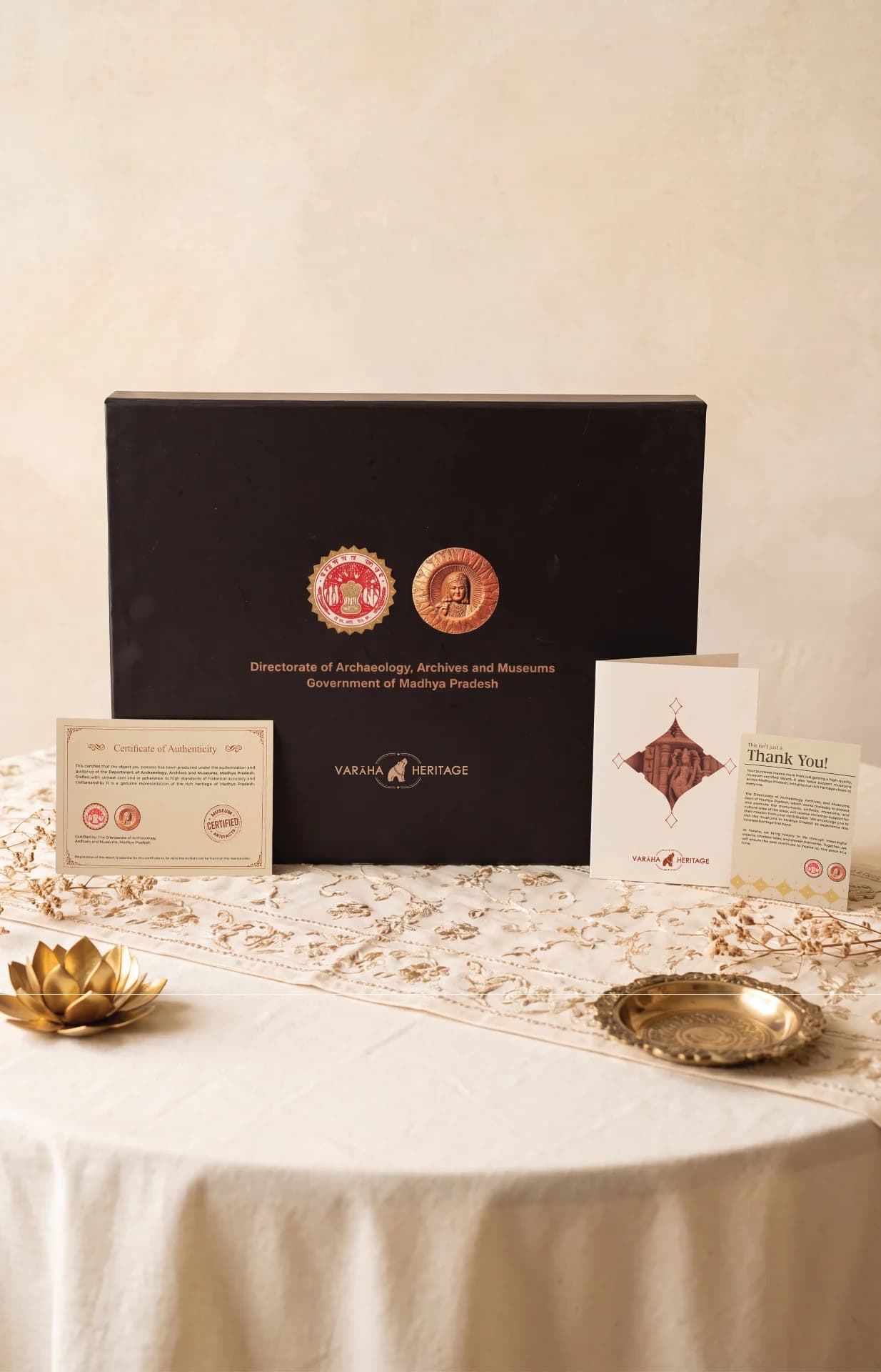 The Dwara Shakha Sculpture packaging box displayed with its official certificate of authenticity and a thank you note.