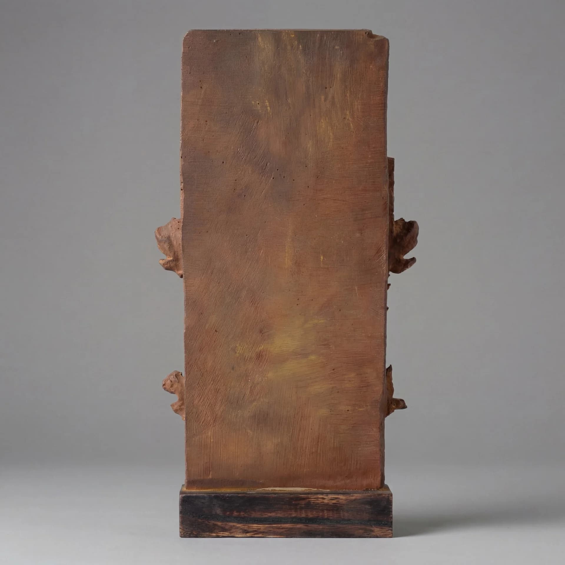 The flat, textured back of the Gajasura Vadha Sculpture replica, showing the stone composite finish and sturdy wooden base.