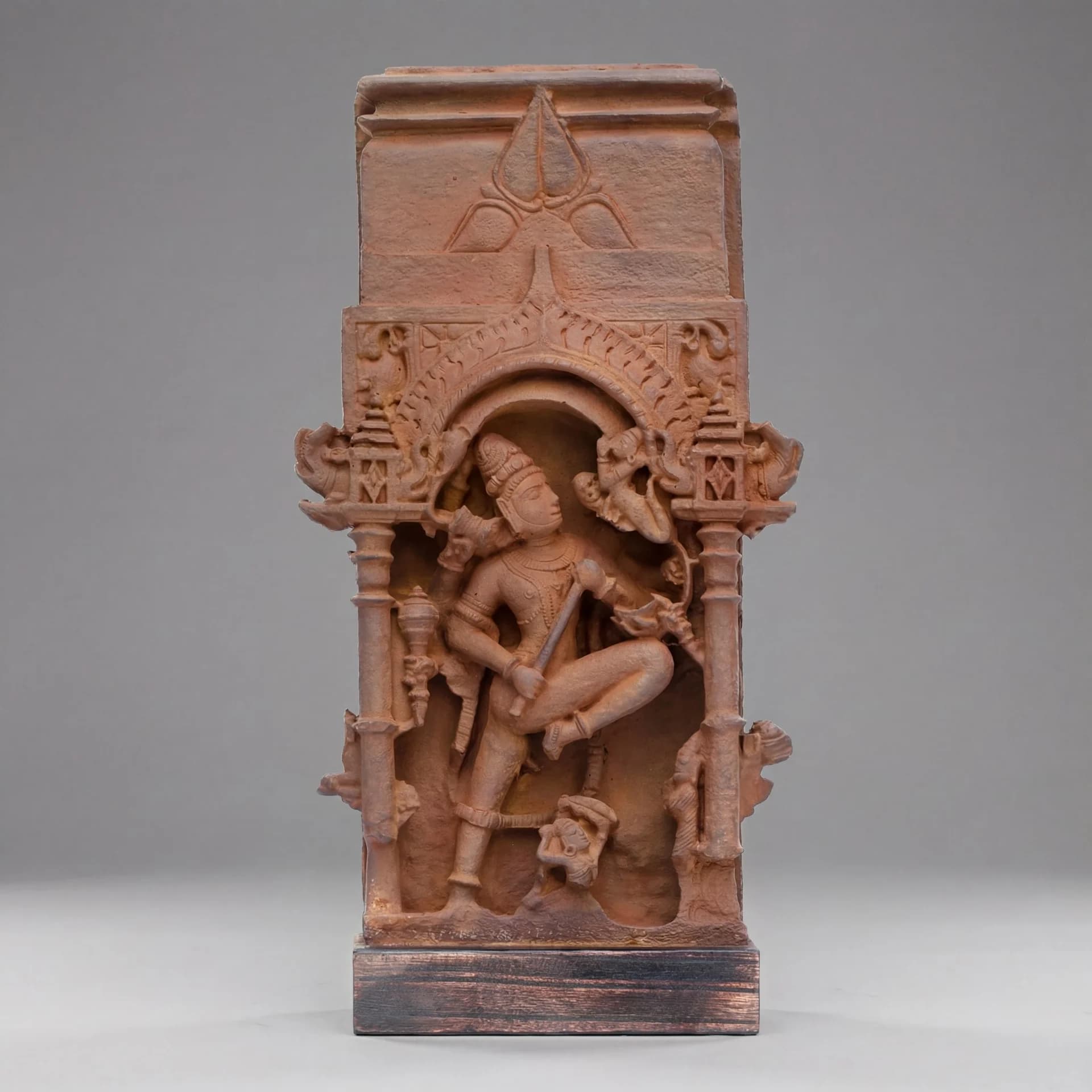 A full front view of the Gajasura Vadha Sculpture, a stone composite replica featuring intricate temple relief carvings of Shiva.