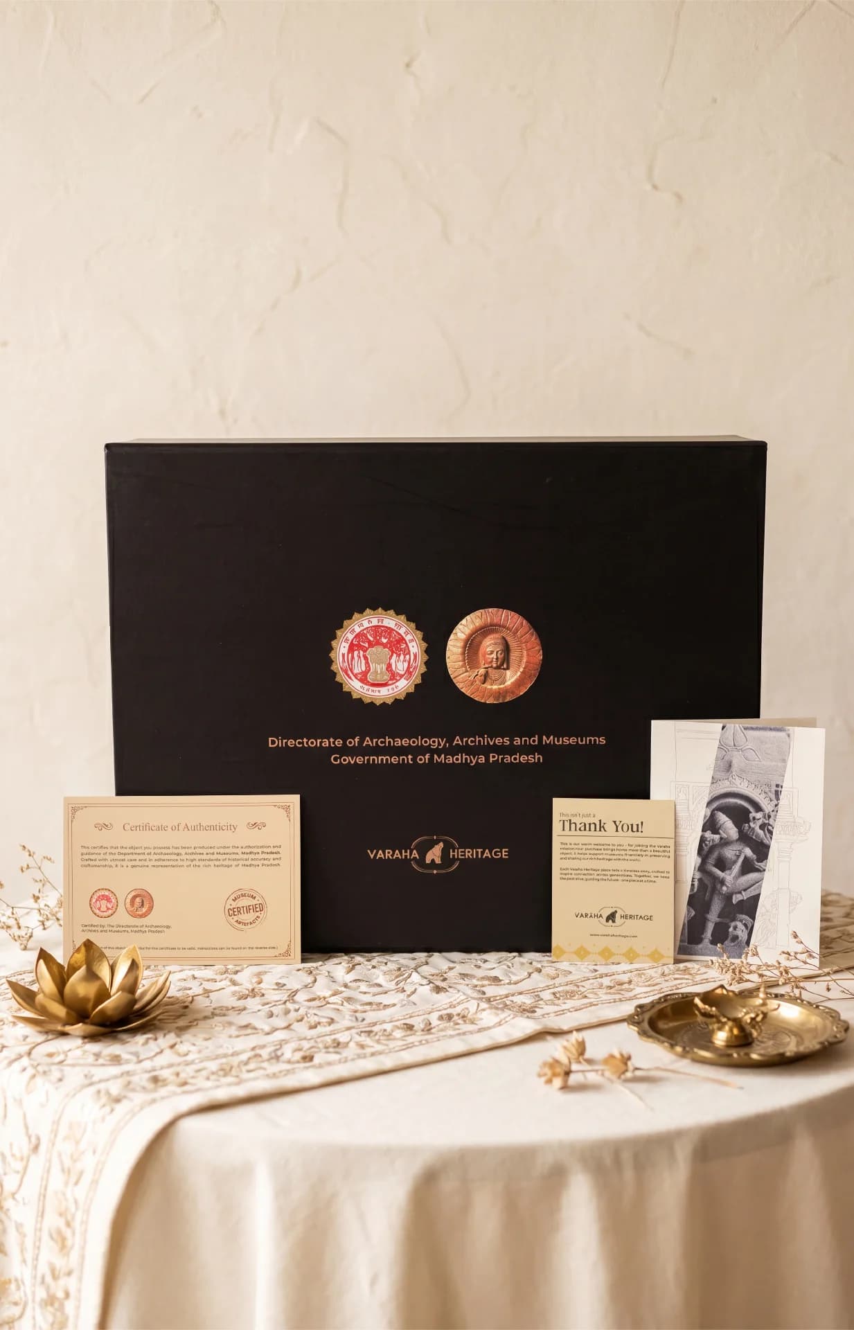 A Gajasura Vadha Sculpture museum replica box set displayed with its certificate of authenticity and heritage information cards.