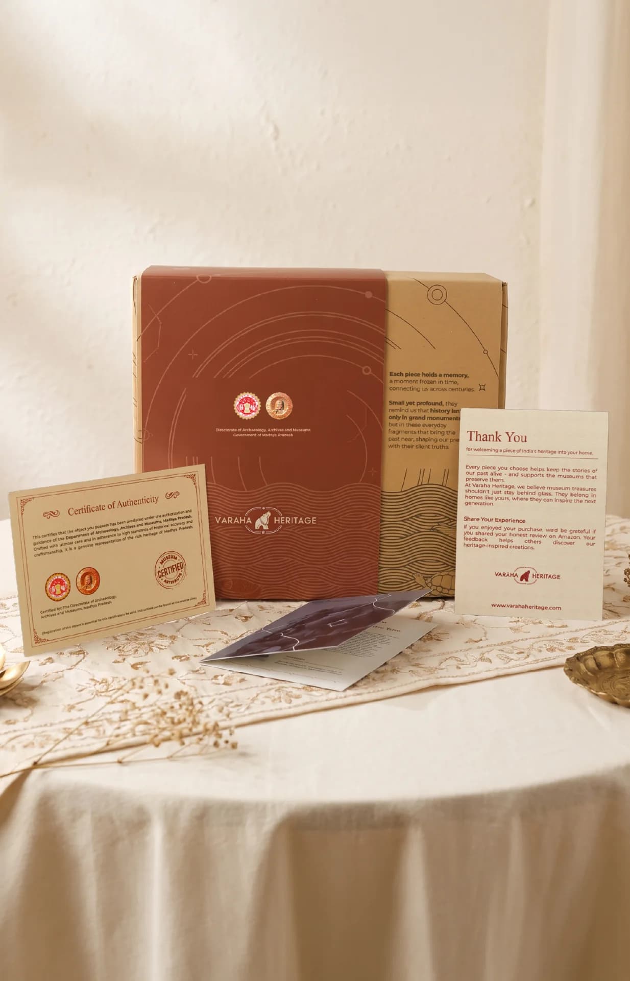 The Ganesha & Lakshmi Narayan Museum Masterpiece Replicas Diwali Heritage Combo packaging displayed with authenticity certificates on a table.