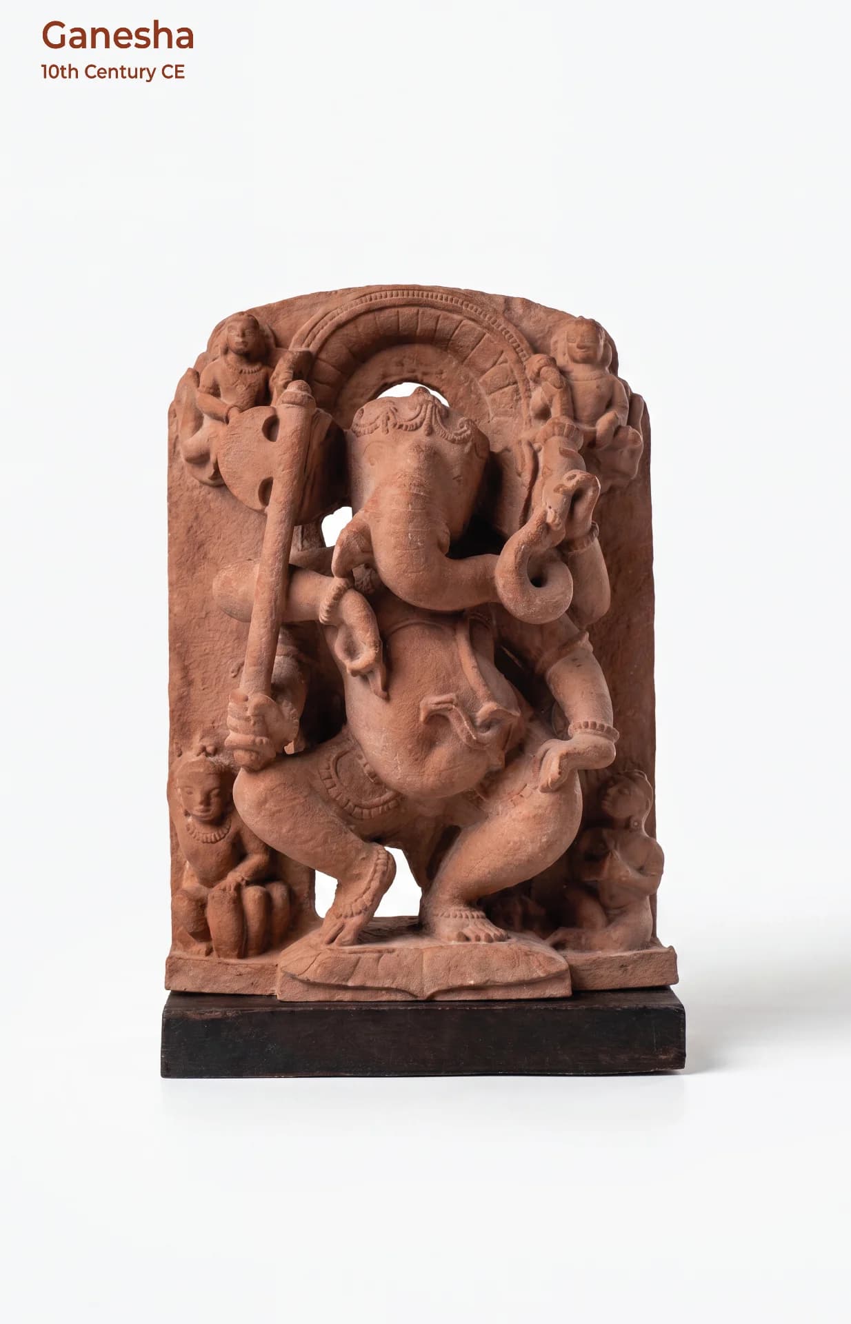 A front-facing view of the Ganesha Sculpture, a hand-finished stone composite replica featuring intricate dancing deity iconography.