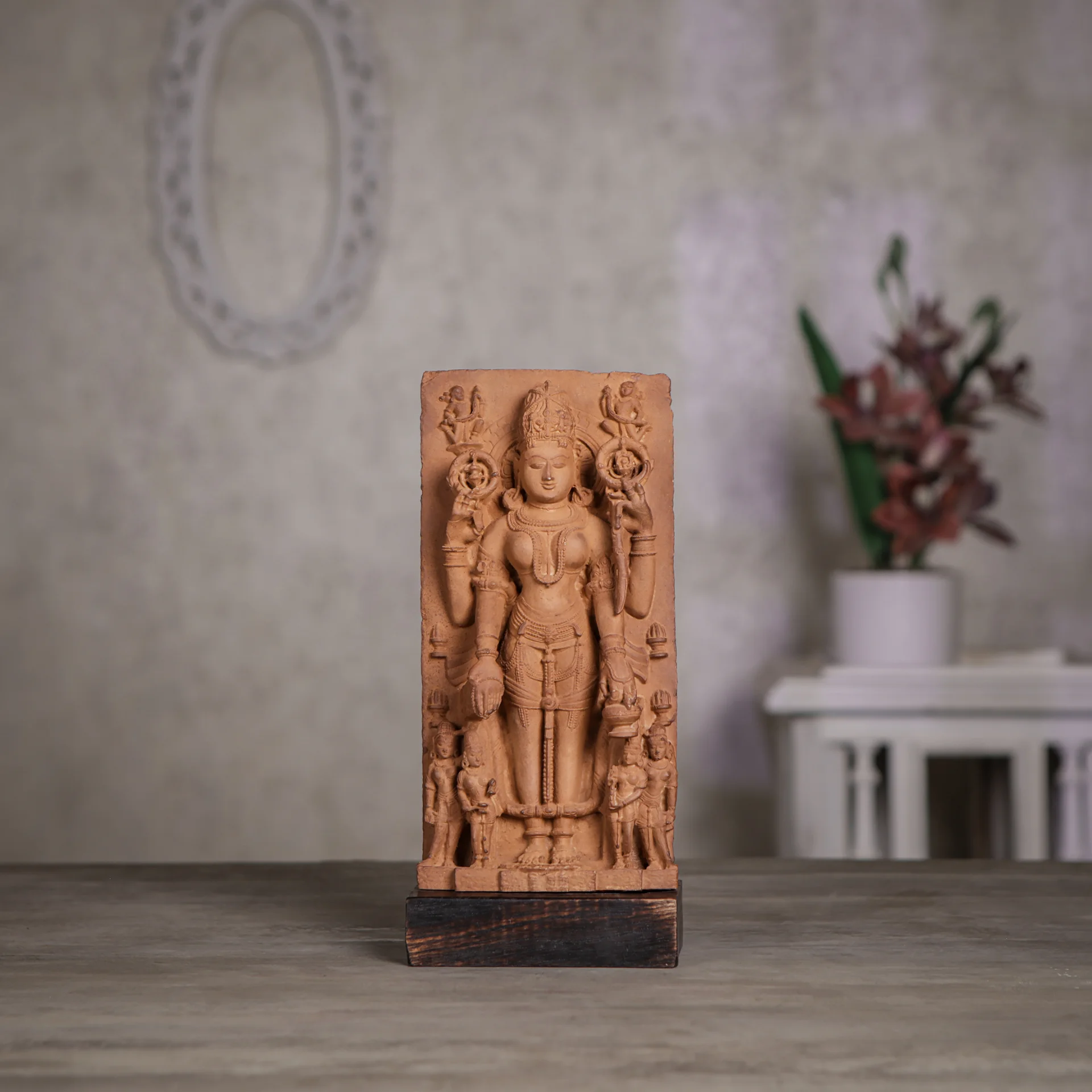 A front-facing view of the Gauri Parvati Sculpture, a detailed stone composite replica featuring intricate Pratihara-style carvings on a wooden base.