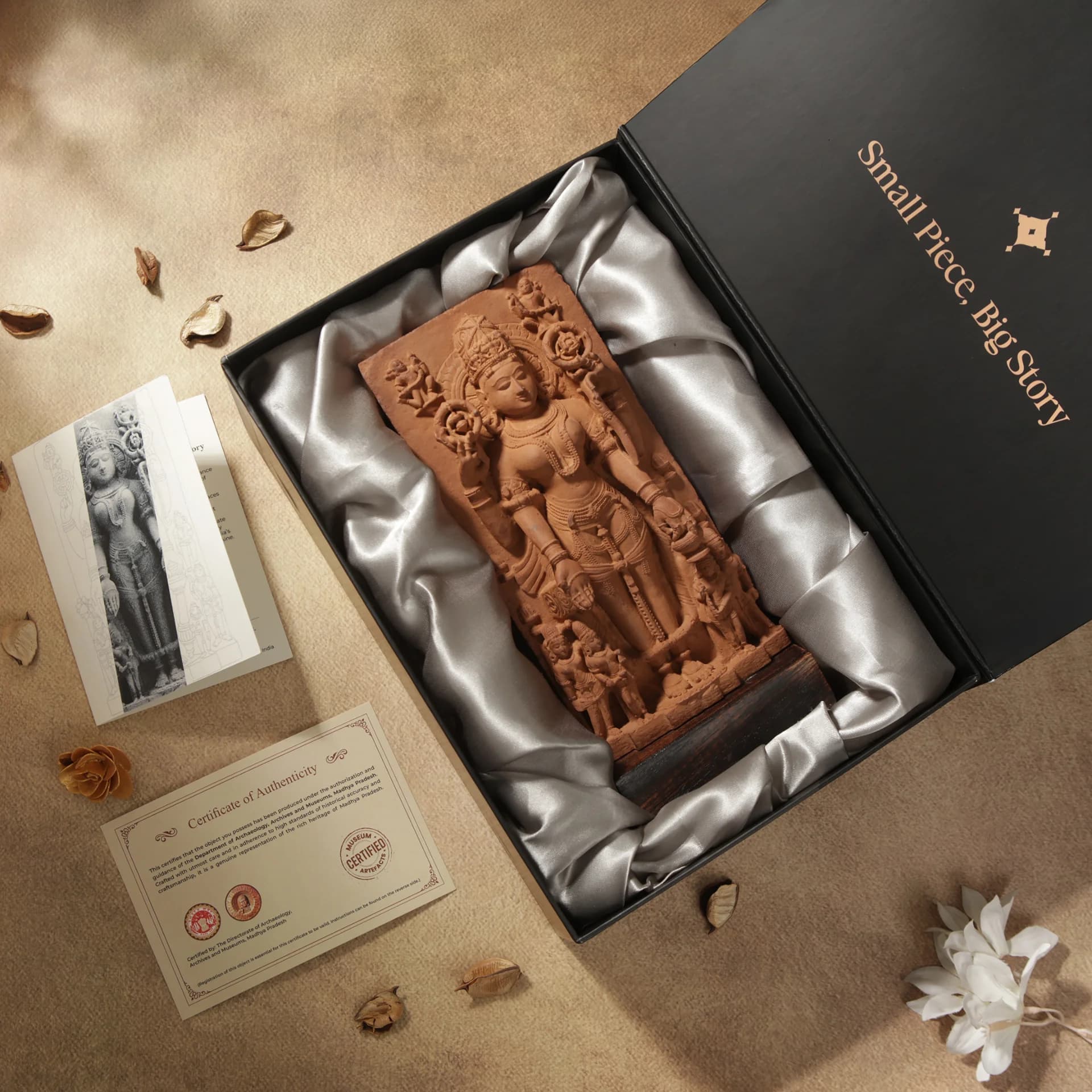 A Gauri Parvati Sculpture stone composite replica rests inside an elegant black gift box with a certificate of authenticity.