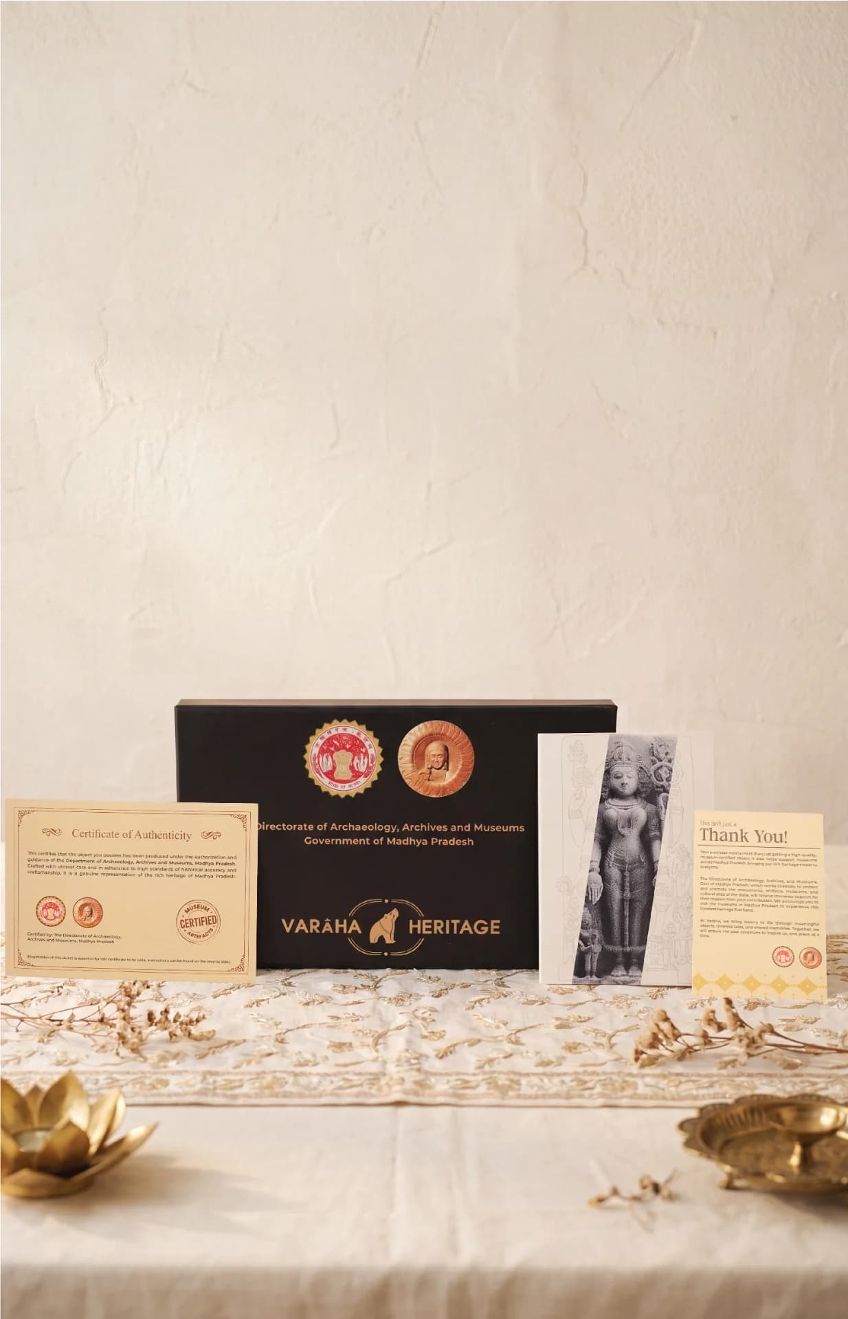 The Gauri Parvati Sculpture packaging set includes a black presentation box, a certificate of authenticity, and an informational card.