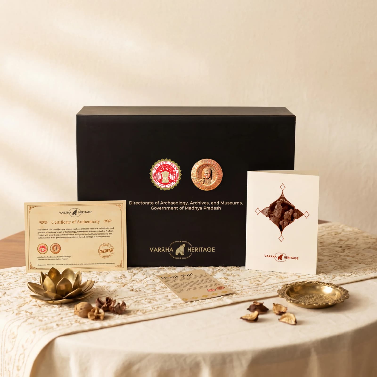 The Lakshmi Narayan Sculpture packaging set includes a black presentation box, certificate of authenticity, and a decorative greeting card.