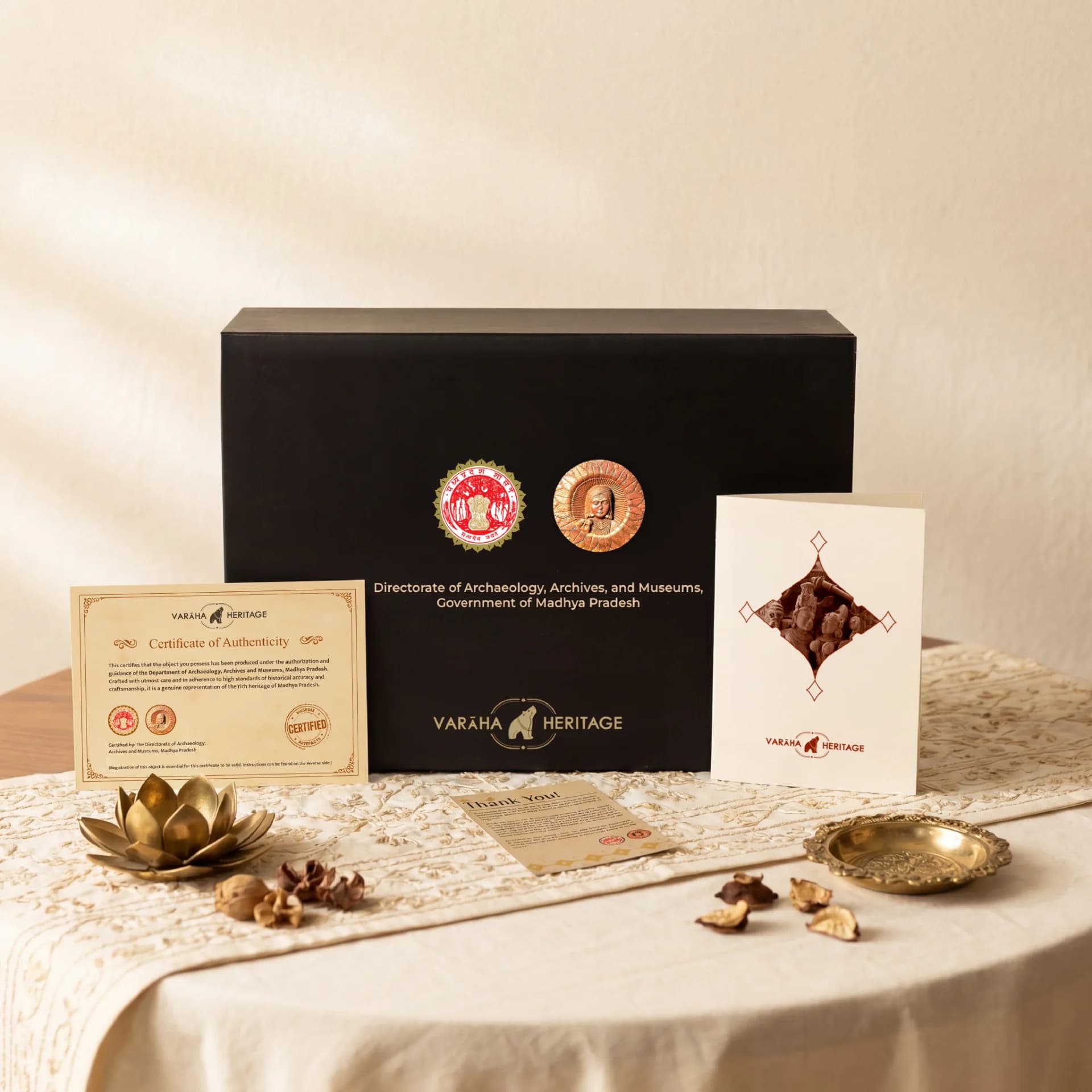 The Lakshmi Narayan Sculpture packaging set includes a black presentation box, certificate of authenticity, and a decorative greeting card.