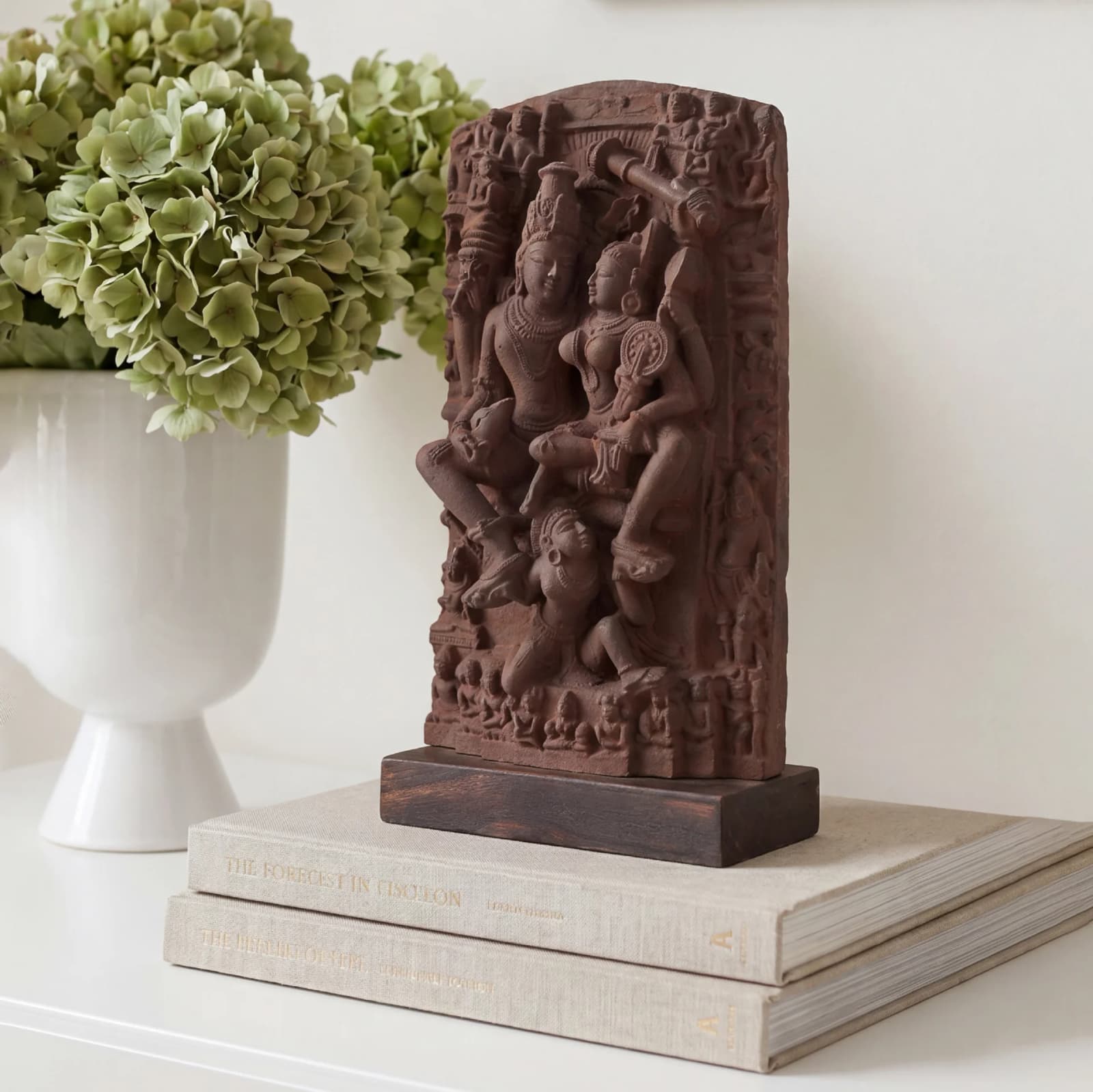 A detailed three-quarter view of the Lakshmi Narayan Sculpture, featuring intricate sandstone-style carvings of the divine couple on a dark base.