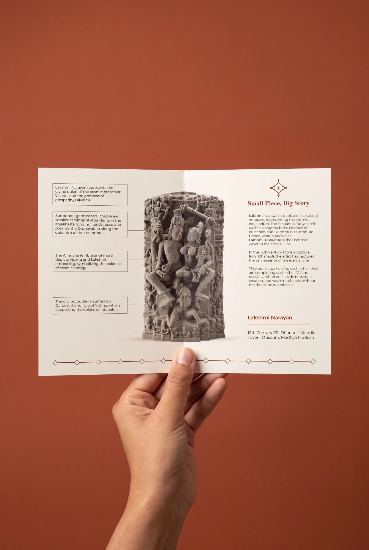 A hand holds an open brochure featuring the Lakshmi Narayan Sculpture, a detailed stone composite replica with educational annotations.
