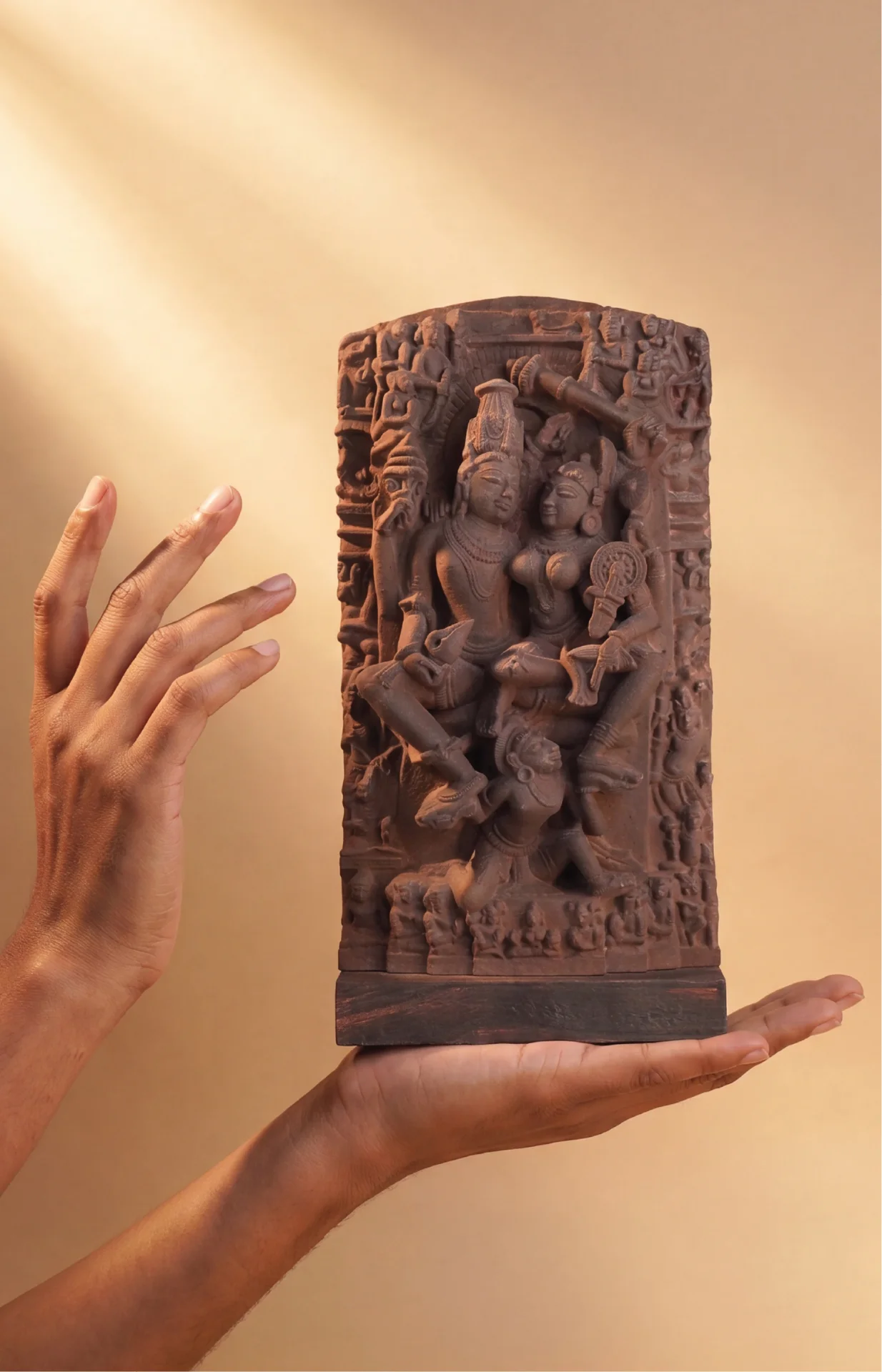 A pair of hands holds an 8-inch Lakshmi Narayan Sculpture, a stone composite replica featuring detailed medieval Hindu iconography.