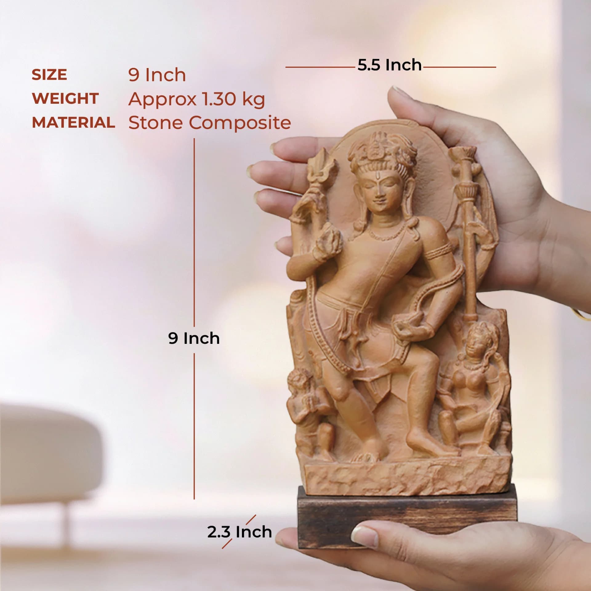 A person holds a stone composite Natesh Shiva Sculpture, showing its size dimensions against a blurred background.