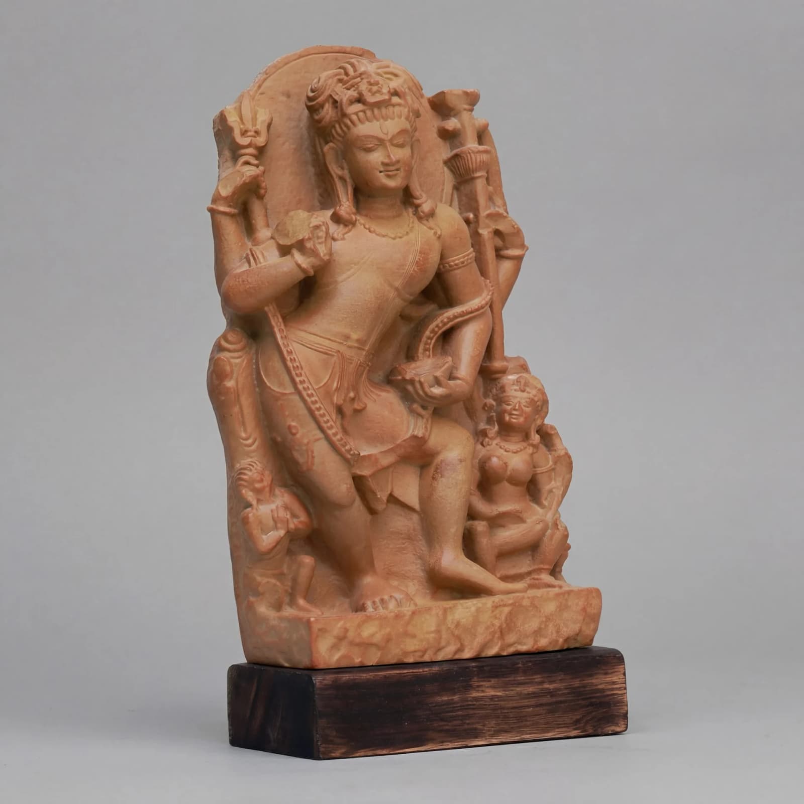 A three-quarter view of the Natesh Shiva Sculpture, a stone composite replica showing intricate dancing poses and traditional Pratihara detailing.