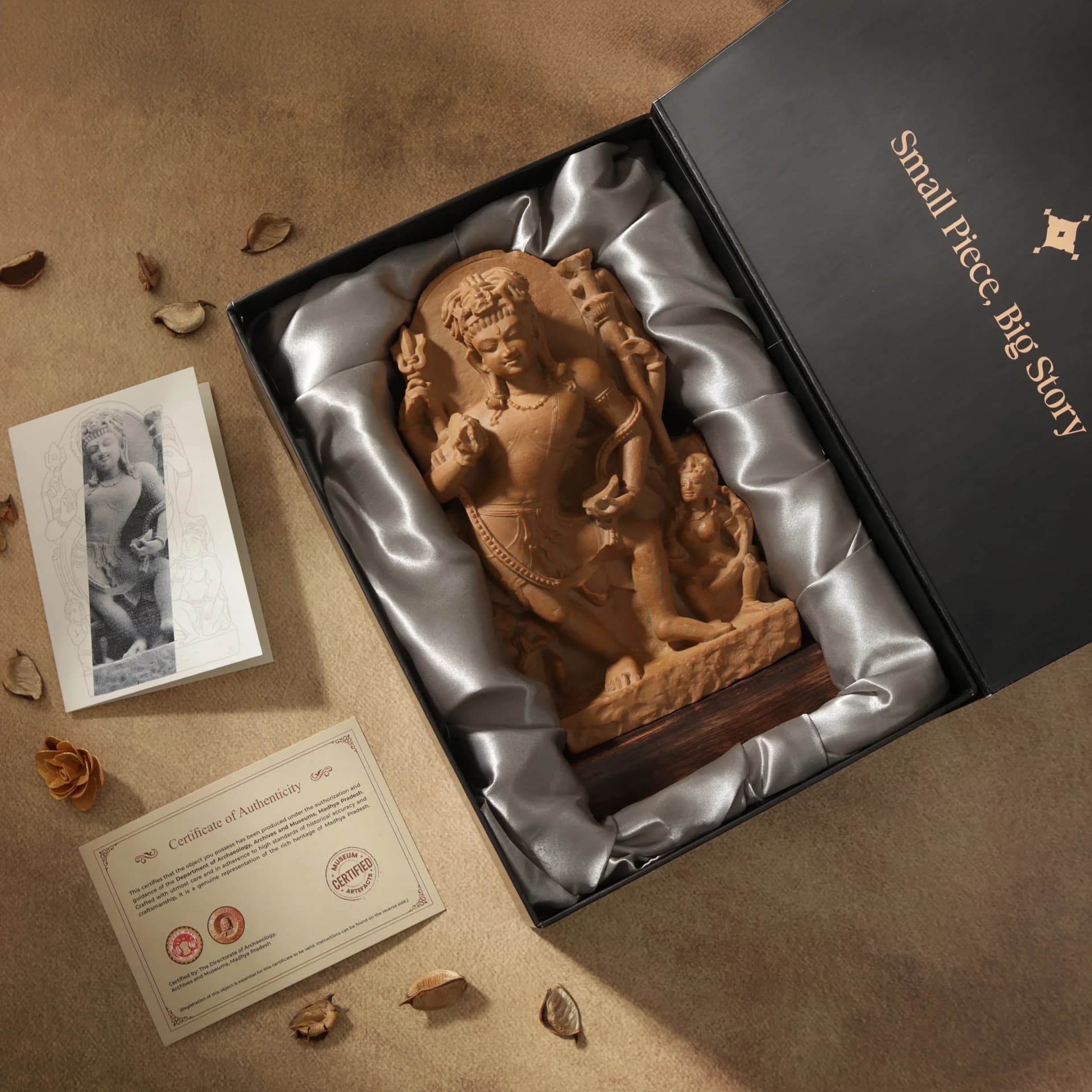 A stone composite Natesh Shiva Sculpture presented in a satin-lined gift box with a certificate of authenticity and information card.