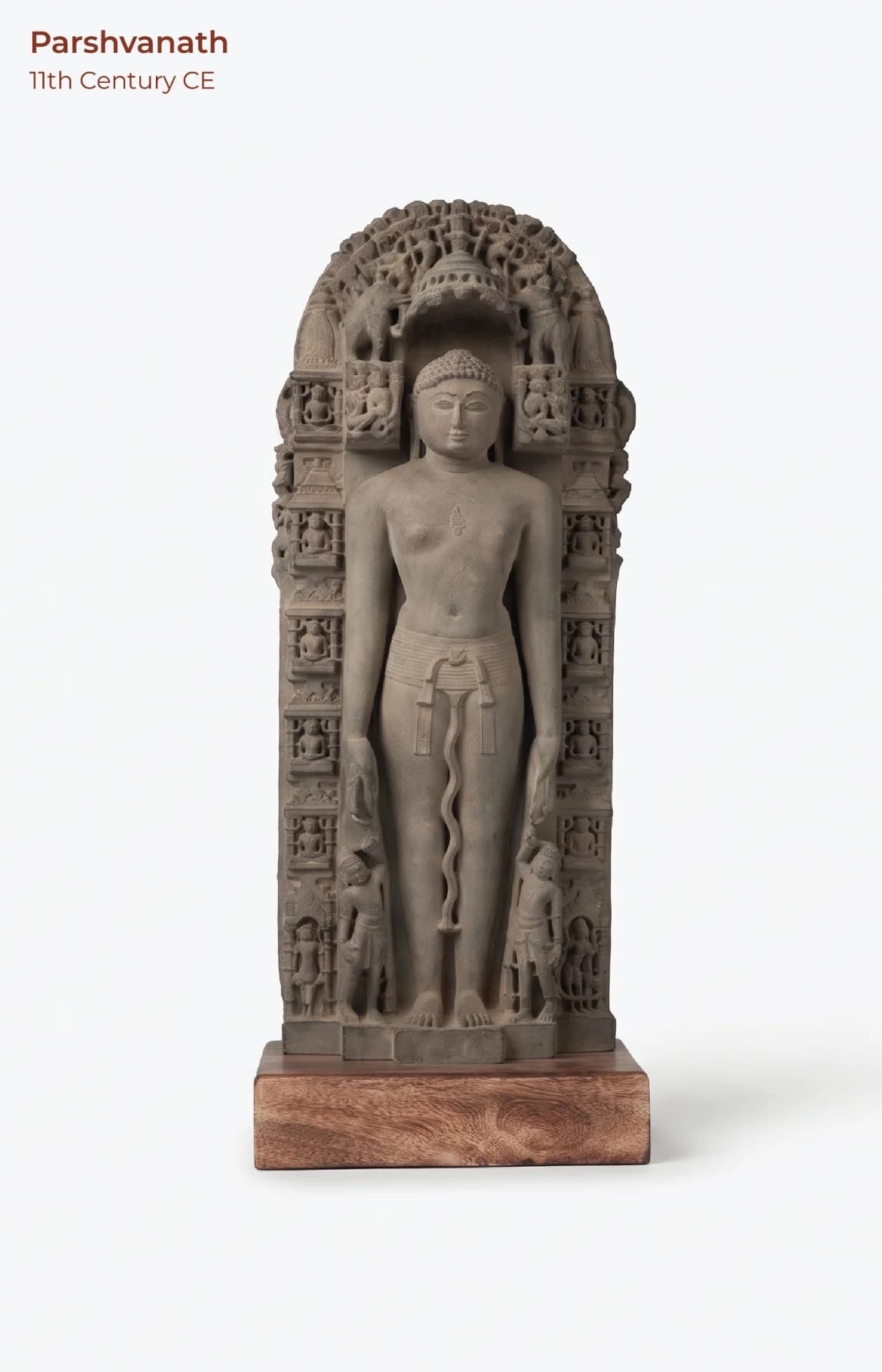 A full-length front view of the Parshvanath Sculpture, a stone composite replica featuring intricate Solanki-era carvings and details.